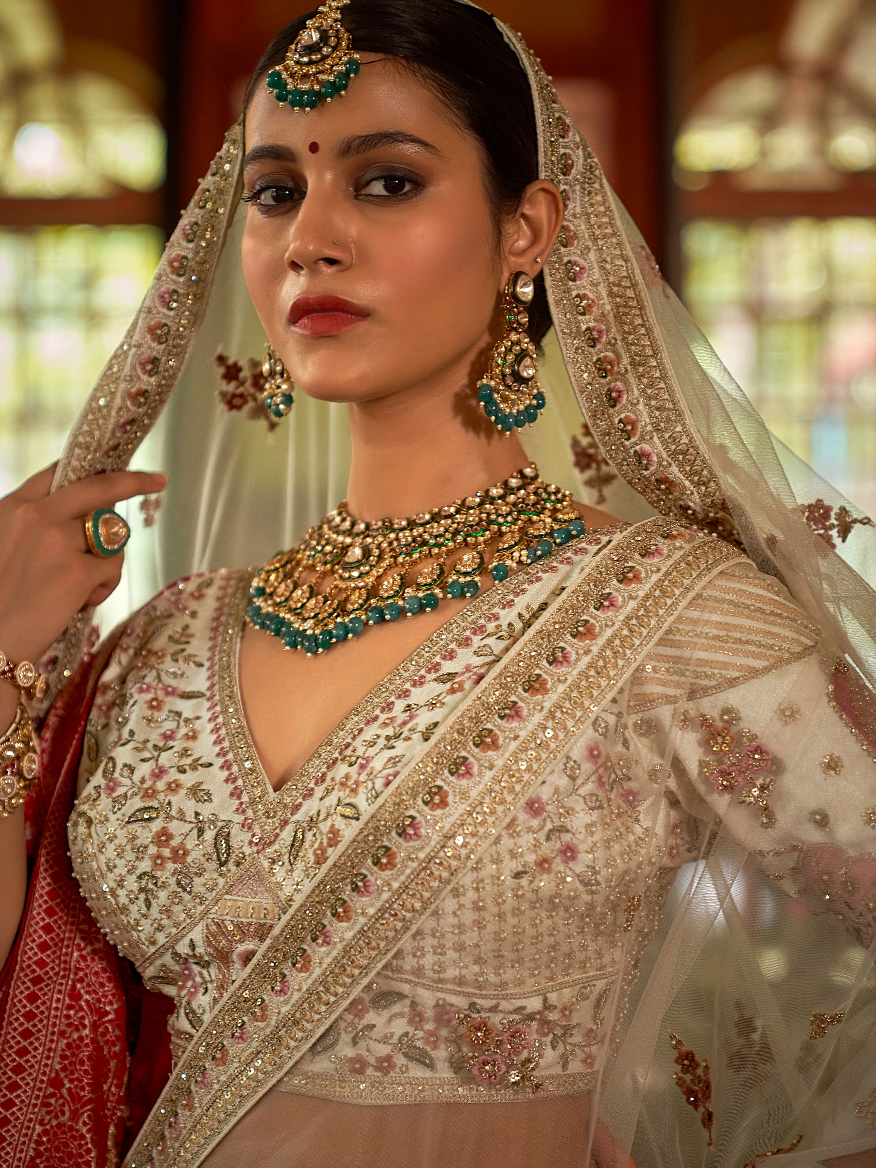 Ivory bridal lehenga with heavy zari weaving and 5-meter flair