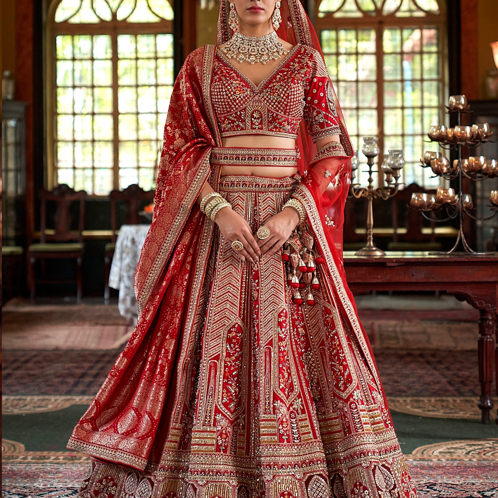 Designer red lehenga with sequins, pearls, and 5-meter flair