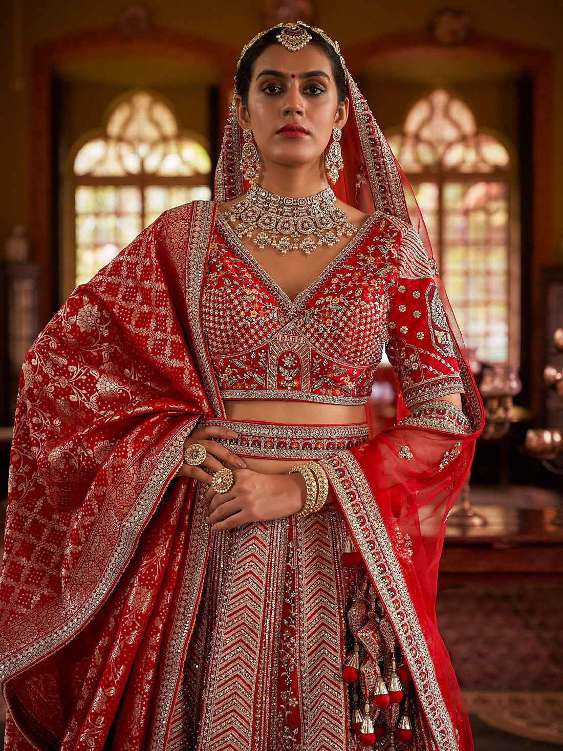 Designer red lehenga with sequins, pearls, and 5-meter flair