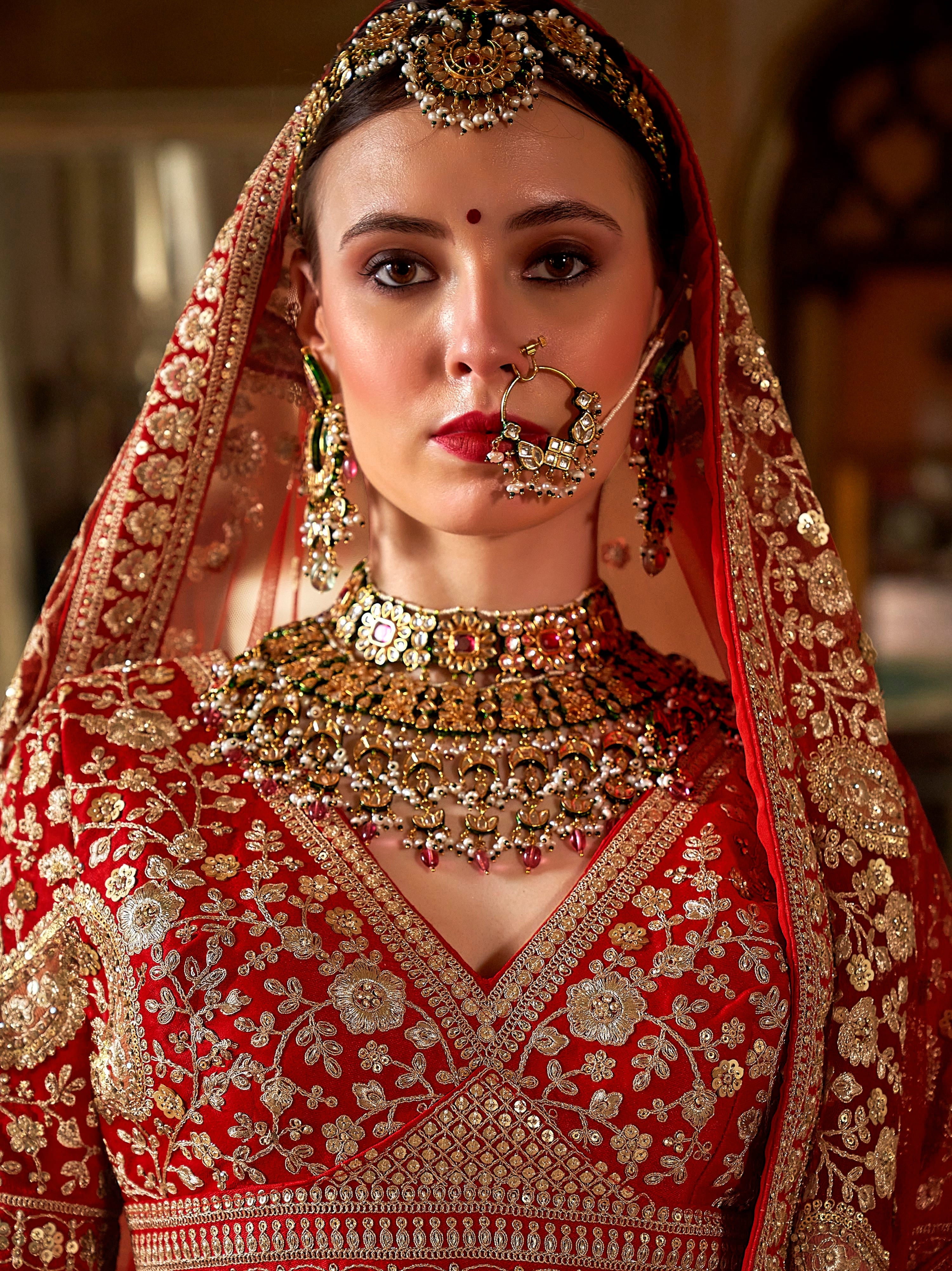 Traditional red lehenga with zari weaving and embroidery