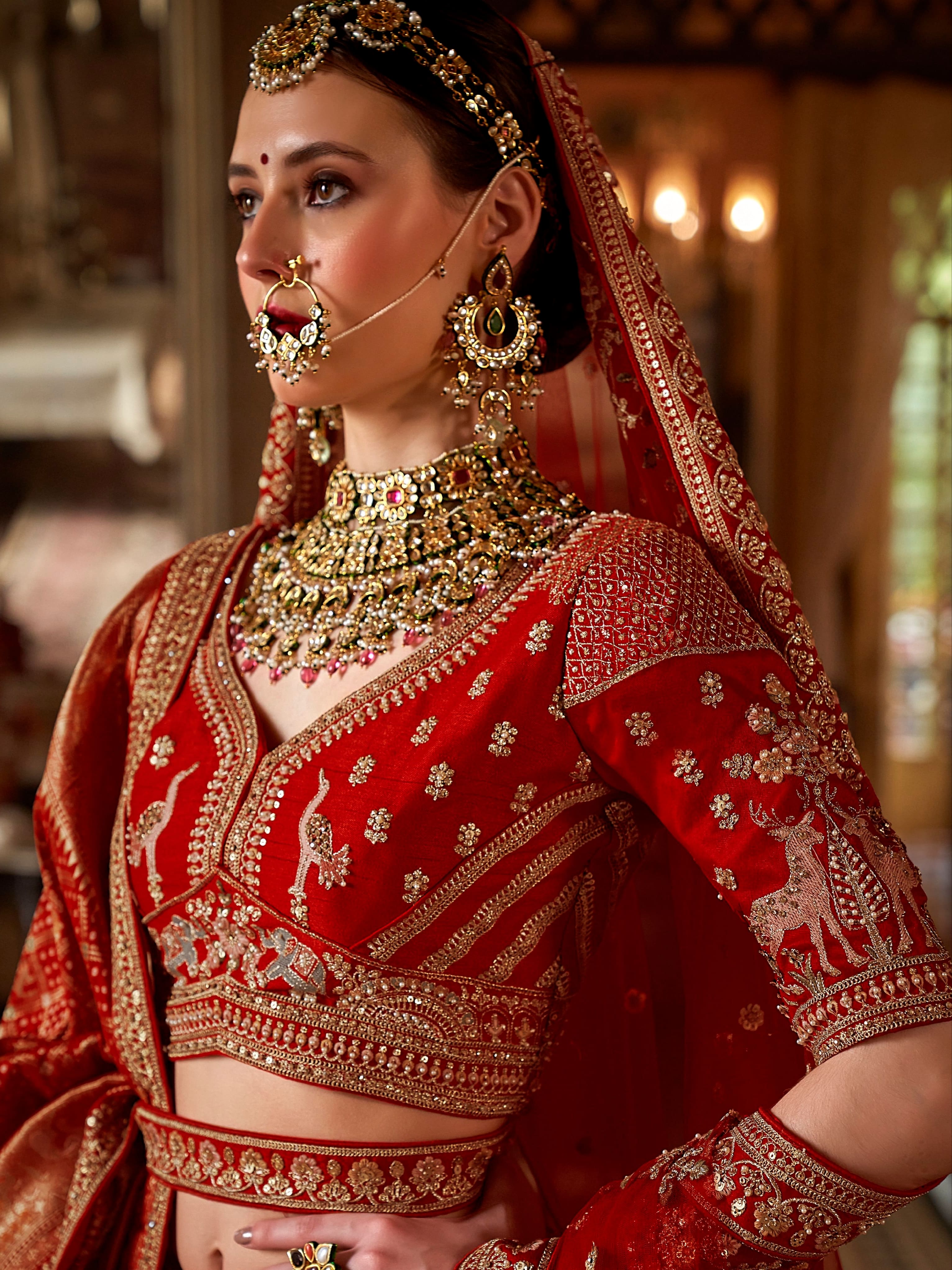 Traditional silk bridal lehenga in crimson red color