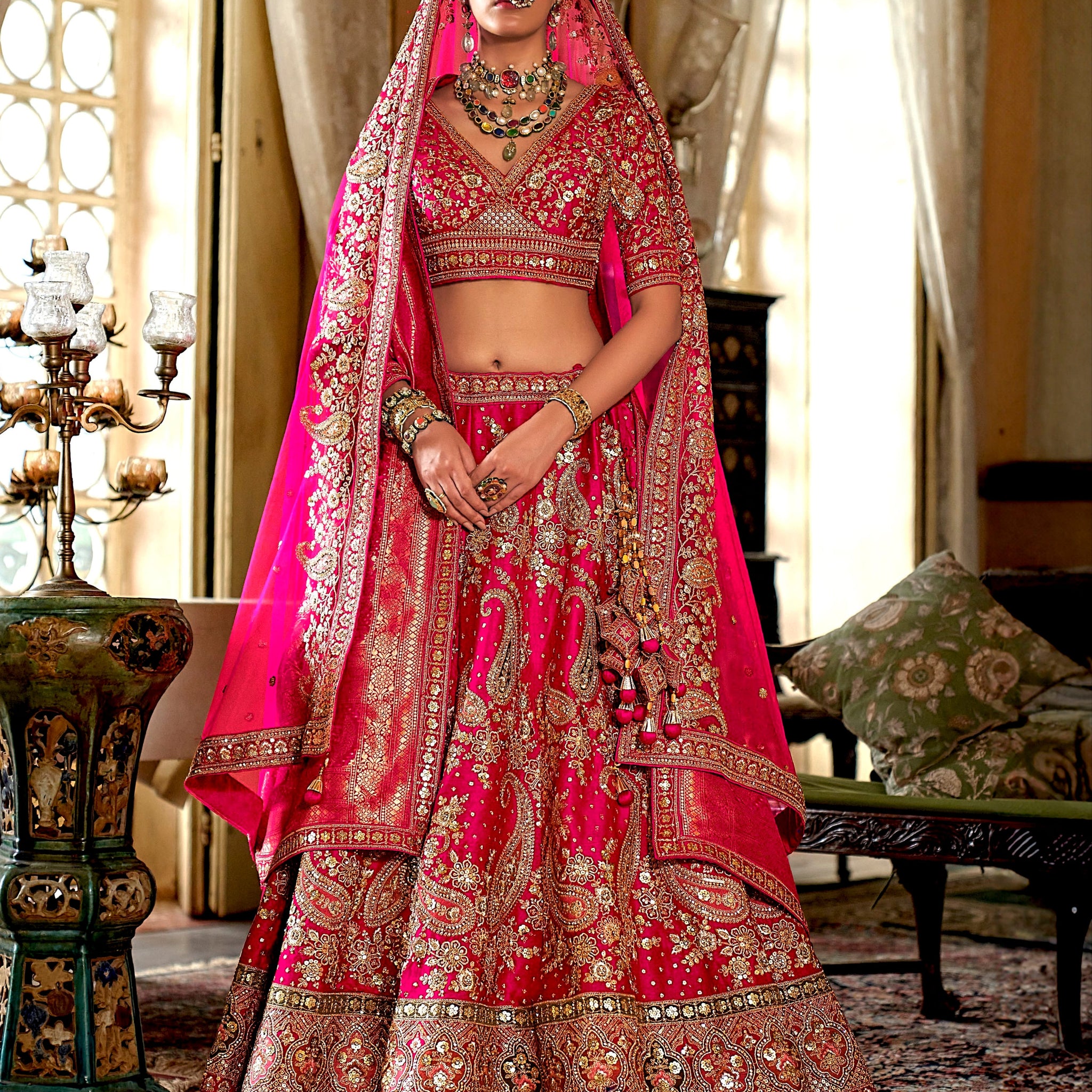 Rani pink bridal silk lehenga with heavy embroidery