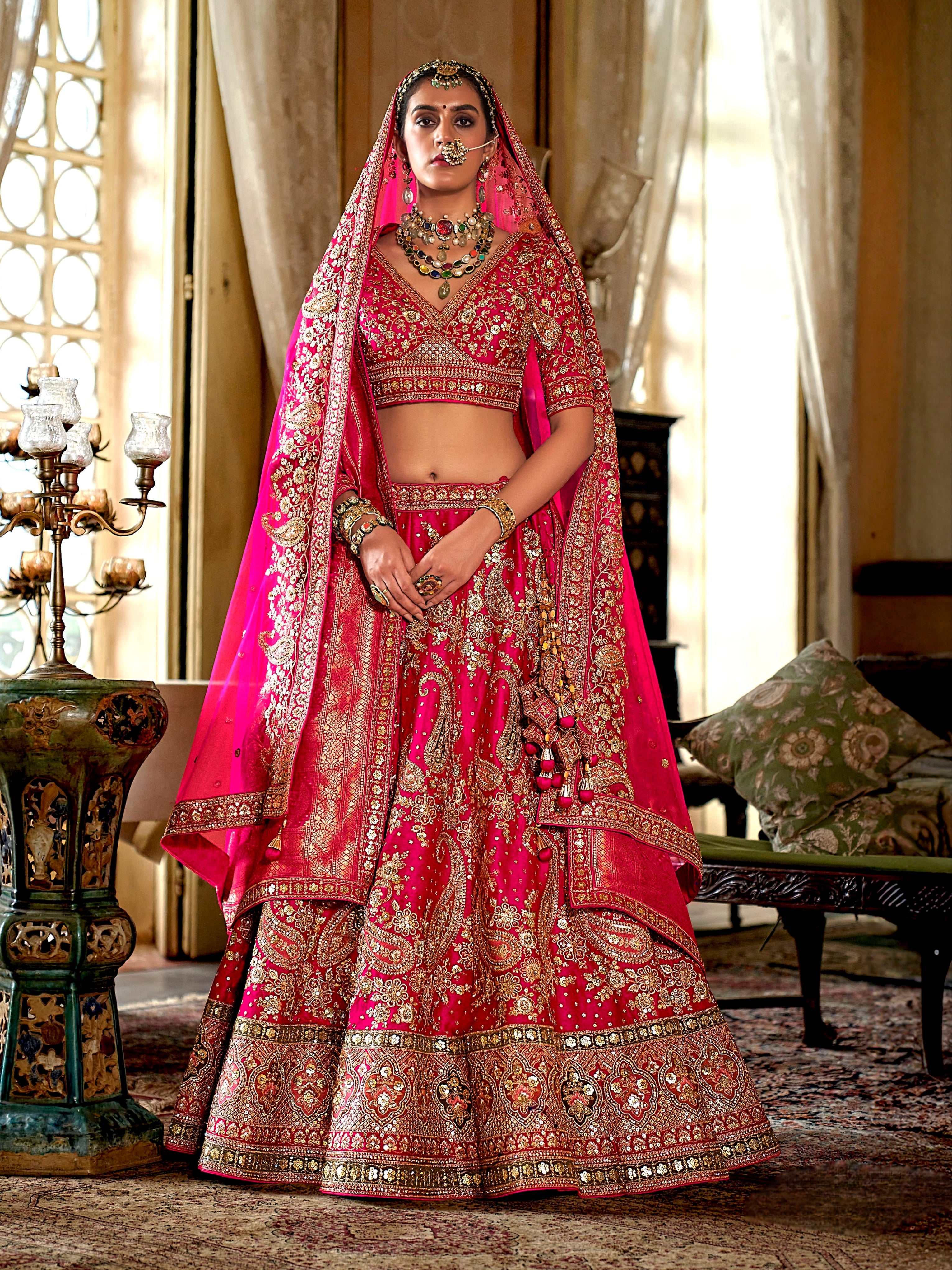 Rani pink bridal silk lehenga with heavy embroidery