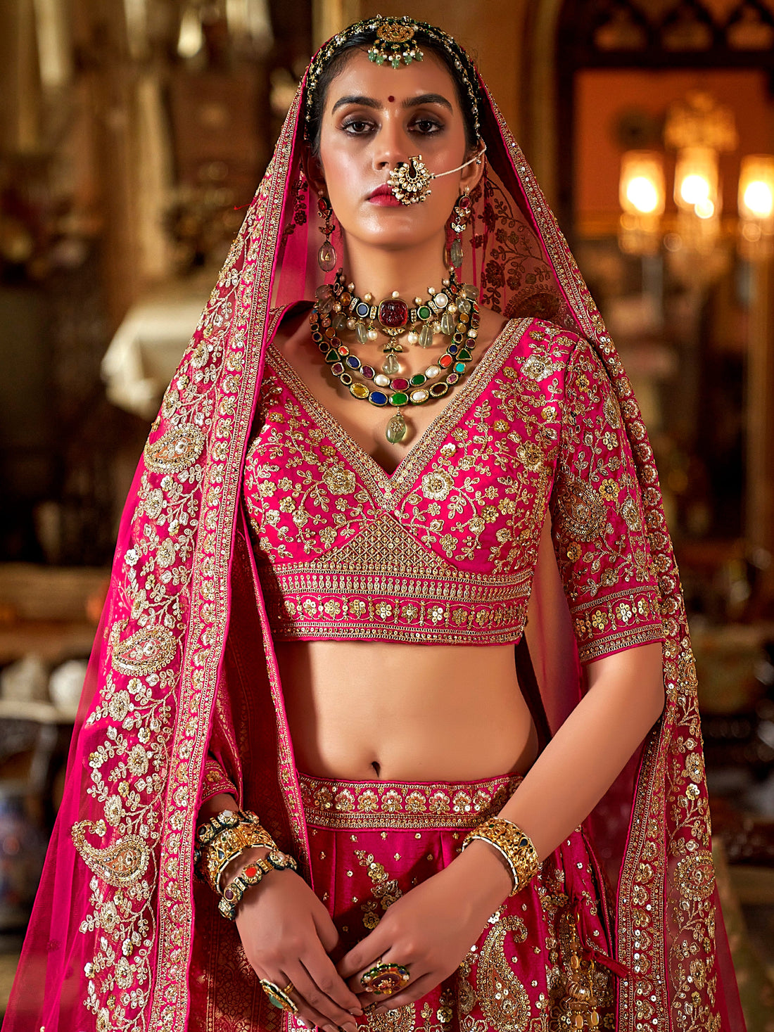 Rani pink bridal silk lehenga with heavy embroidery
