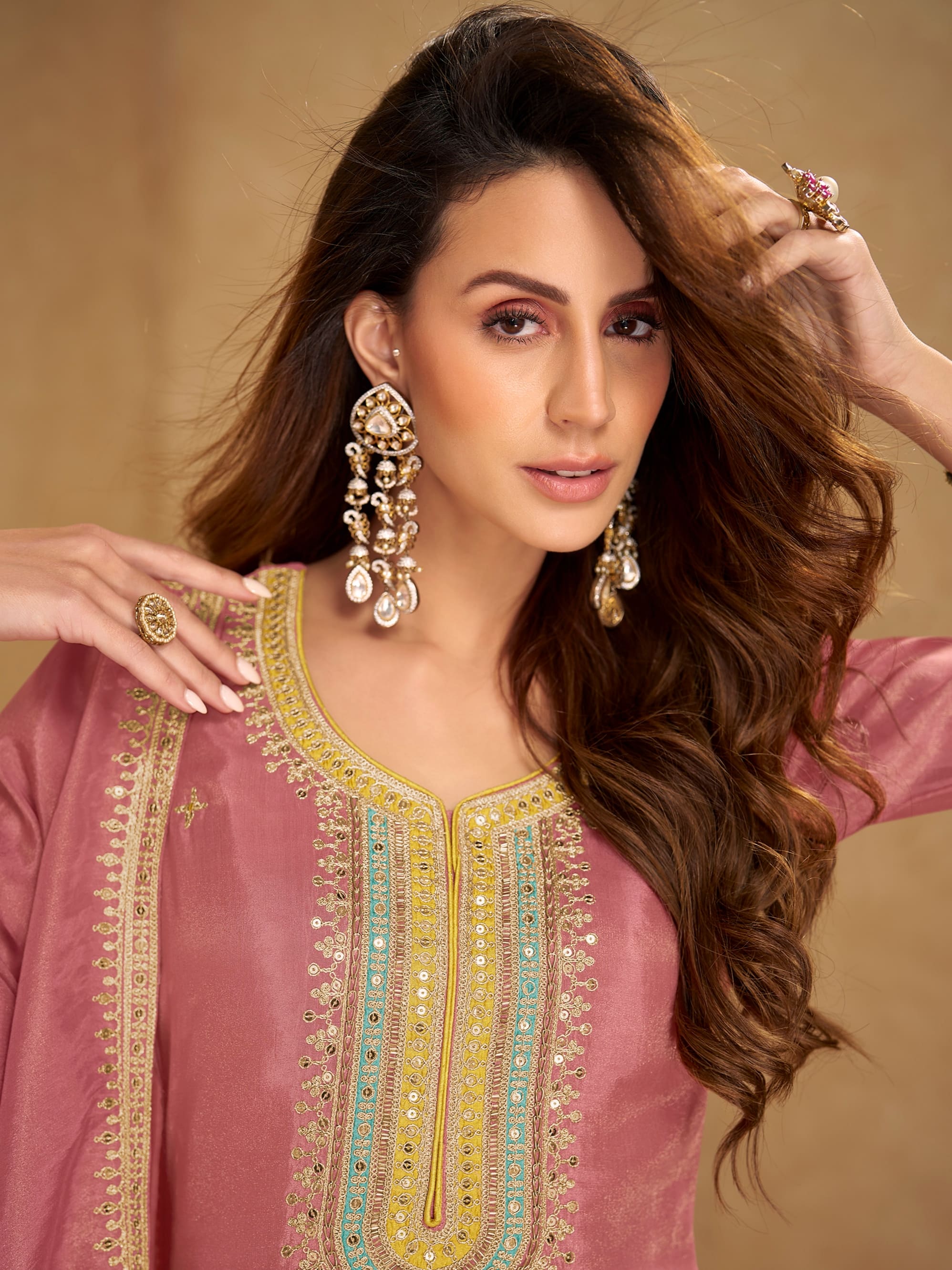 Designer mauve embroidered suit for festive wear