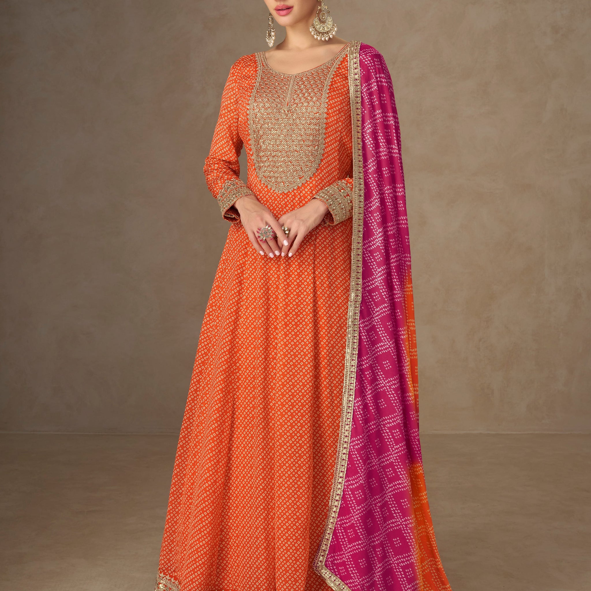 Orange Anarkali suit with pink dupatta for wedding wear