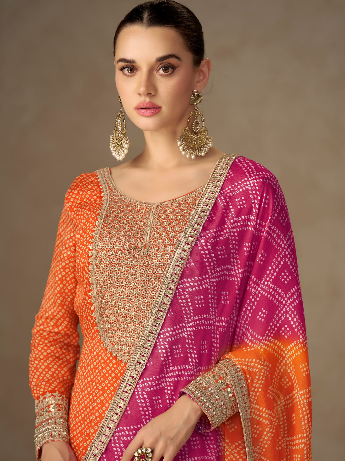 Orange Anarkali suit with pink dupatta for wedding wear