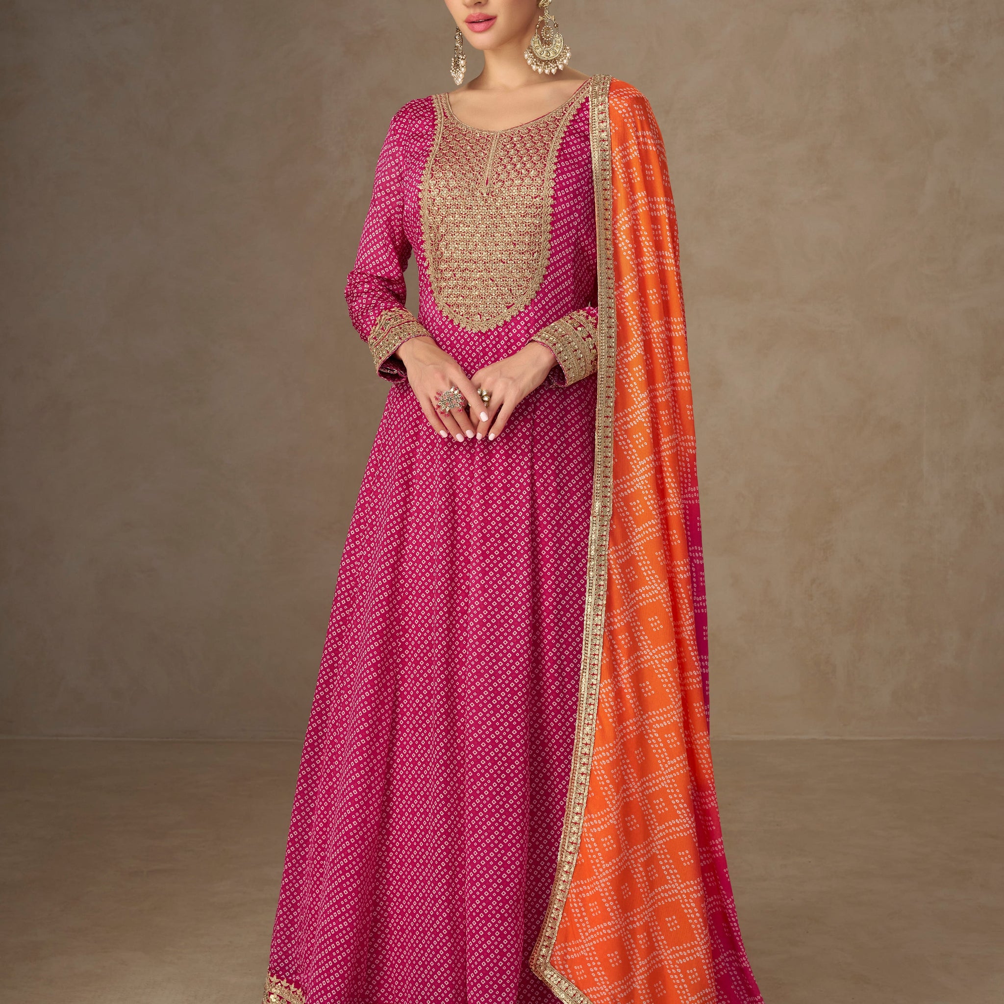 Pink Anarkali suit with orange dupatta for wedding reception