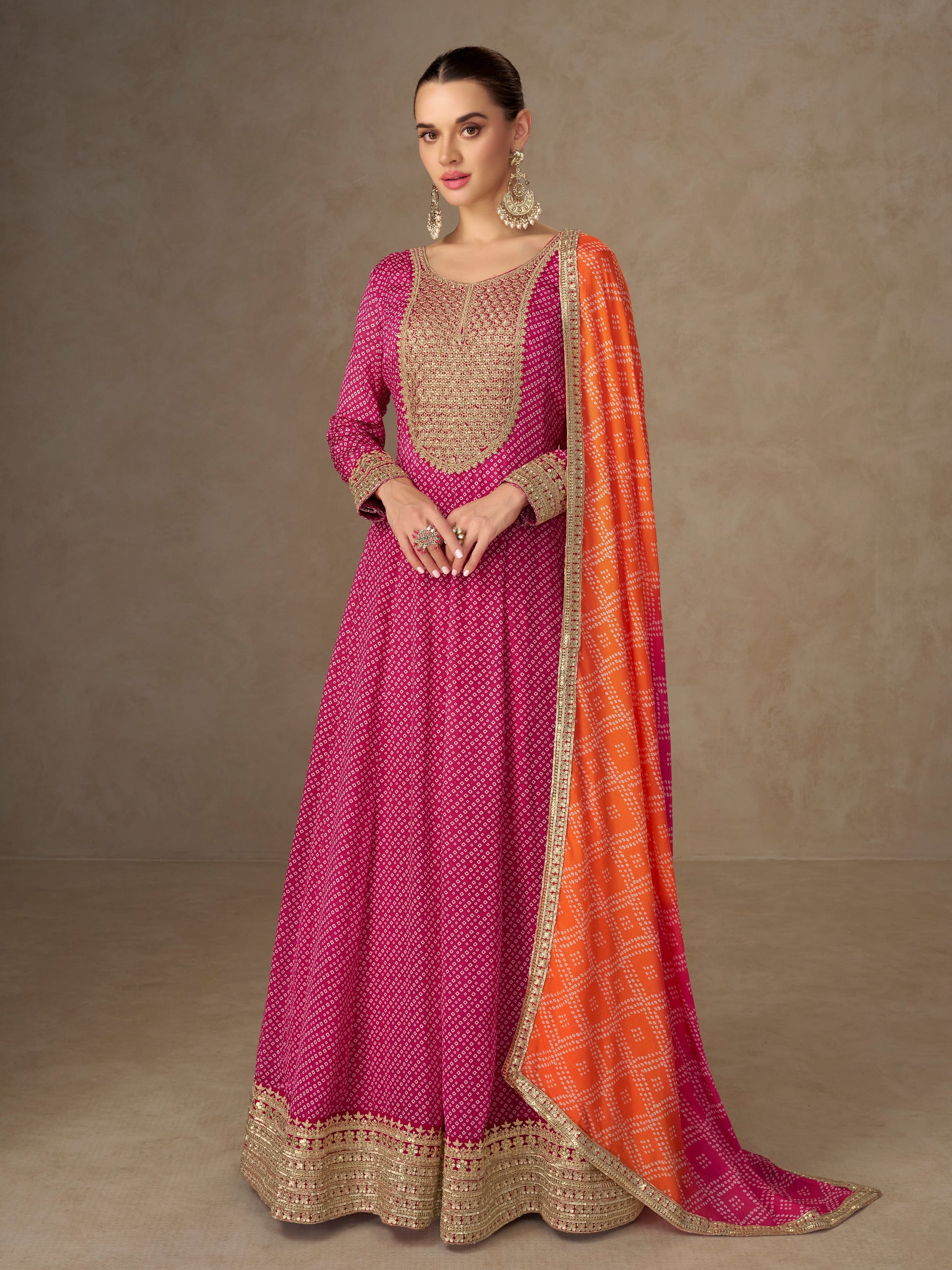 Pink Anarkali suit with orange dupatta for wedding reception