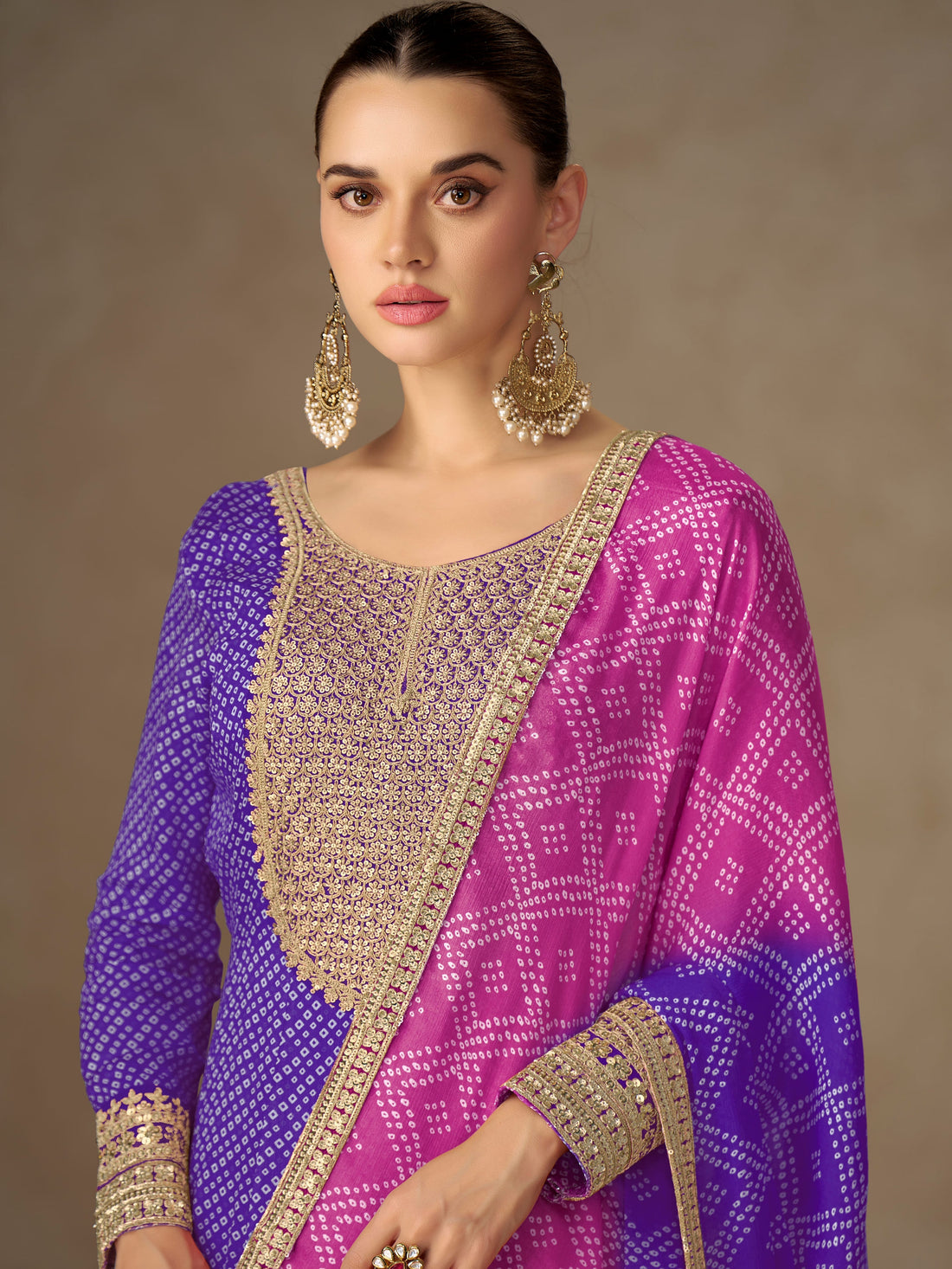 Purple embroidered Anarkali suit with pink dupatta for bridal party