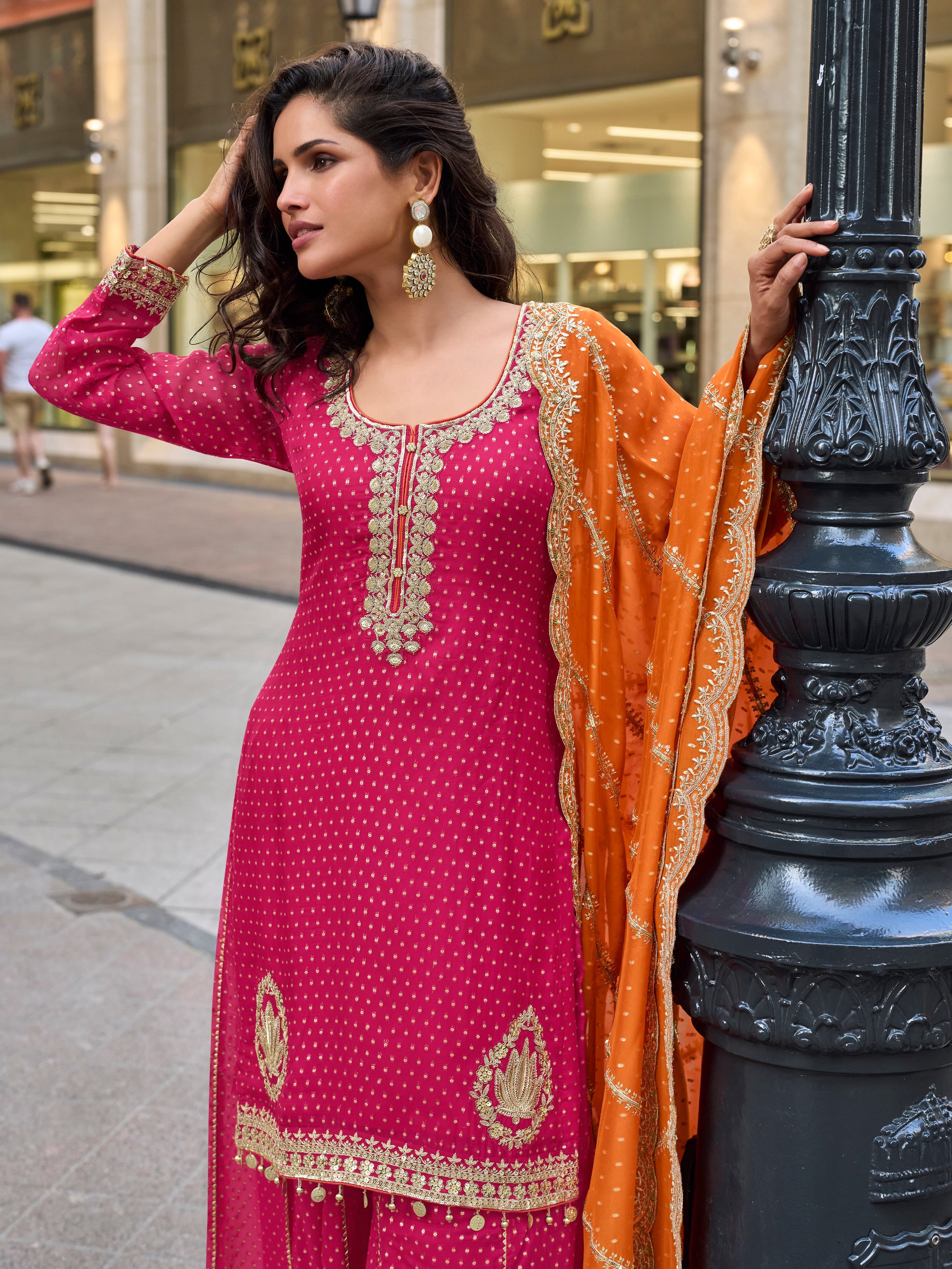 Stylish pink sharara set with contrast dupatta for reception