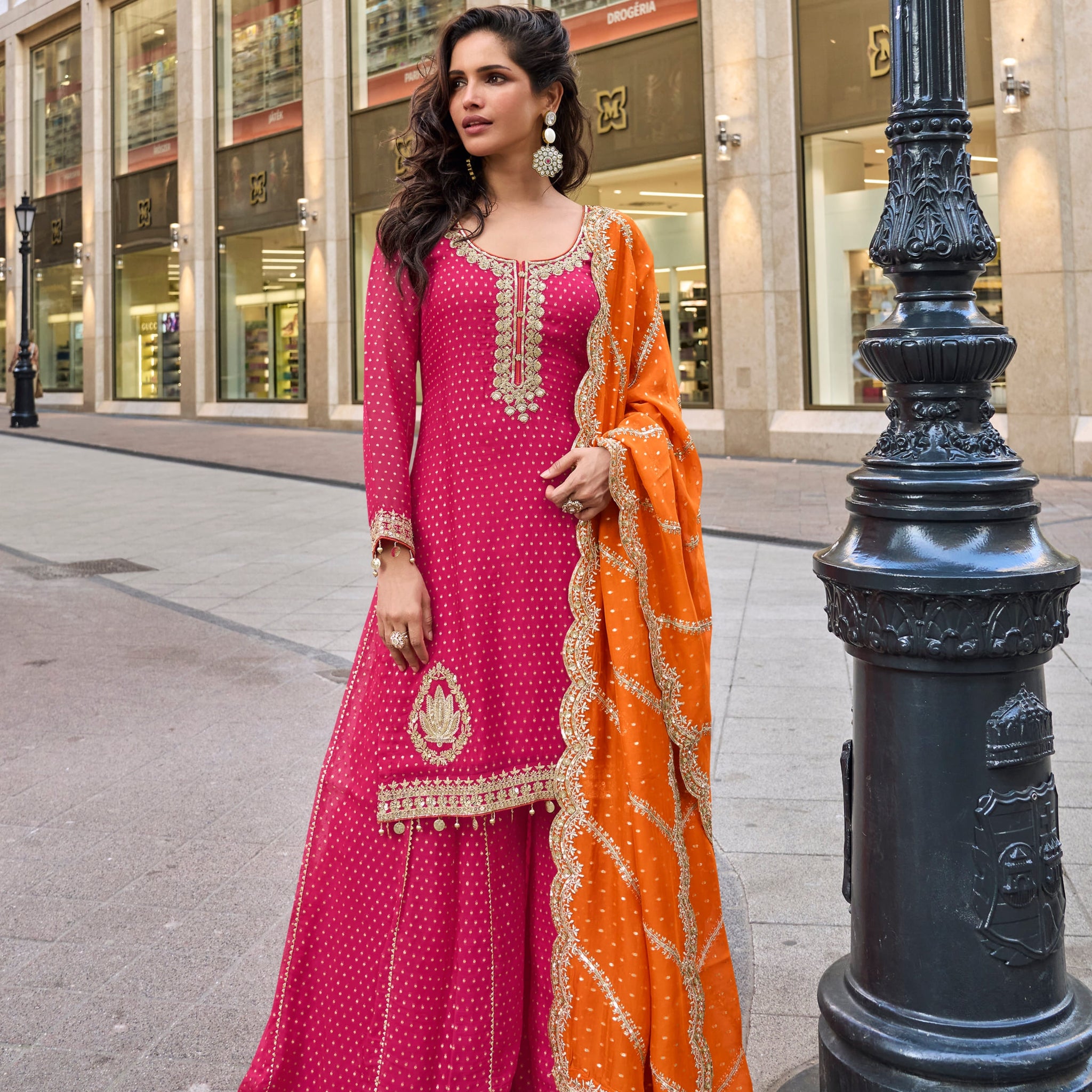 Pink embroidered sharara suit with orange dupatta for weddings