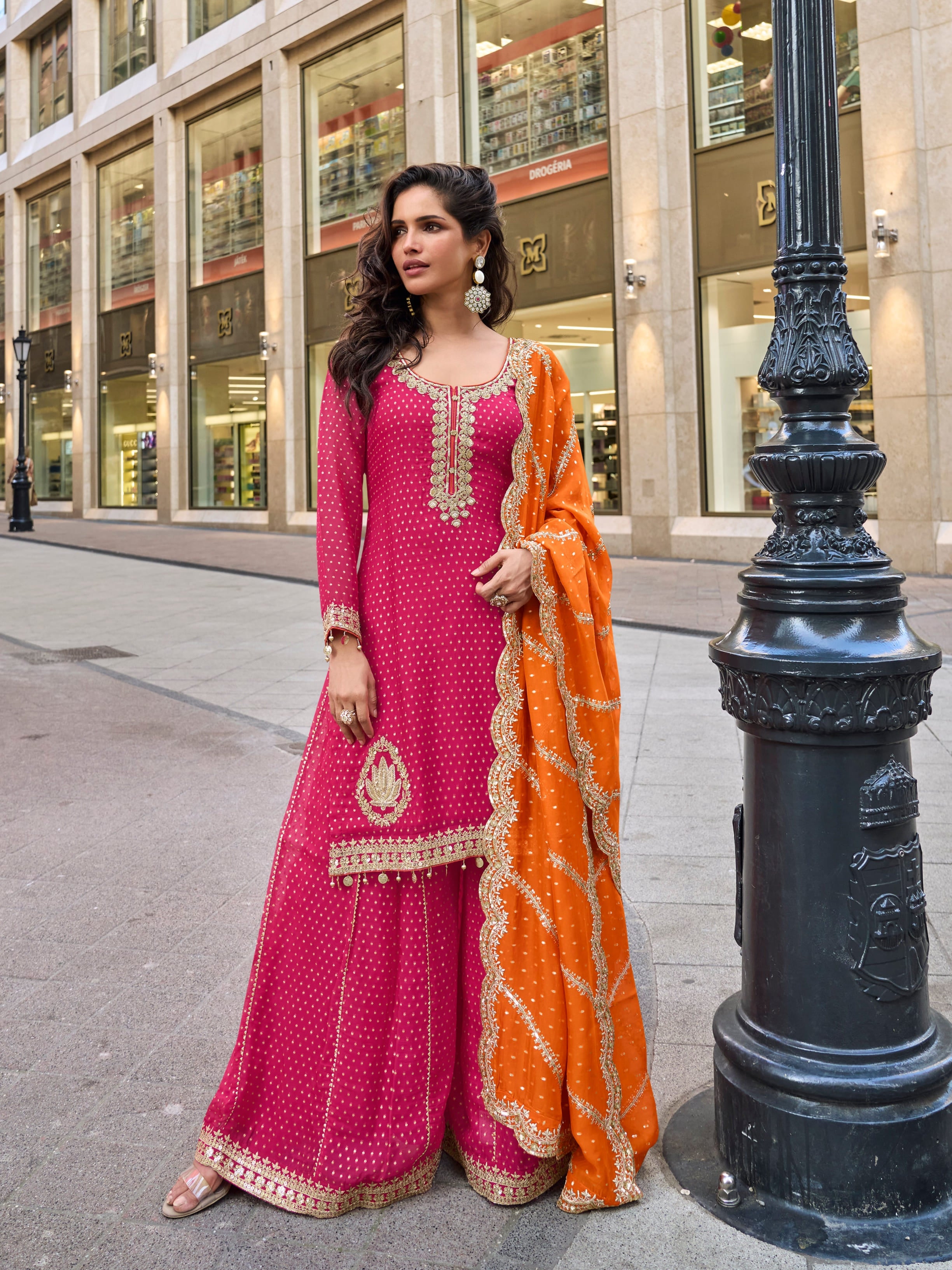Pink embroidered sharara suit with orange dupatta for weddings