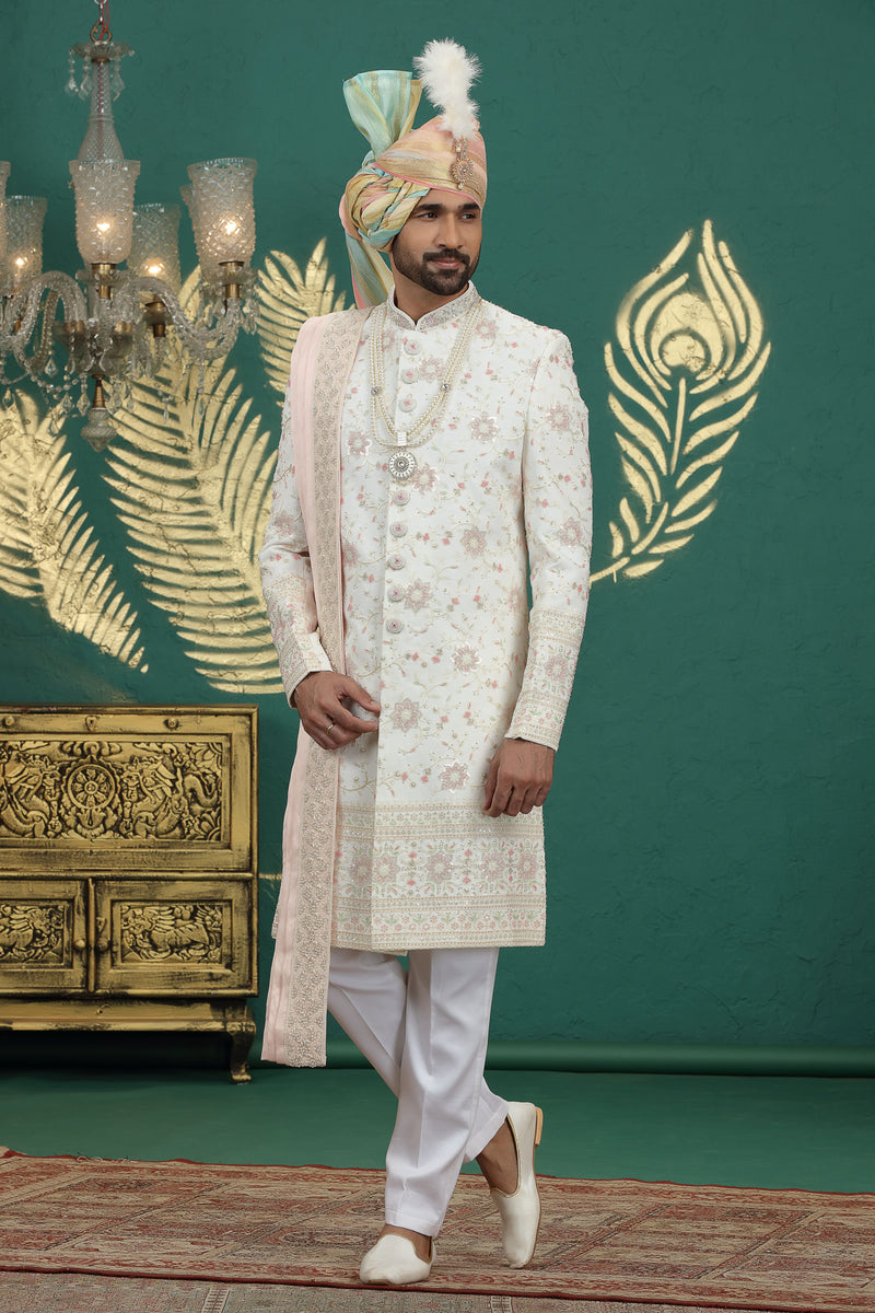 Elegant cream sherwani with traditional hand embroidery