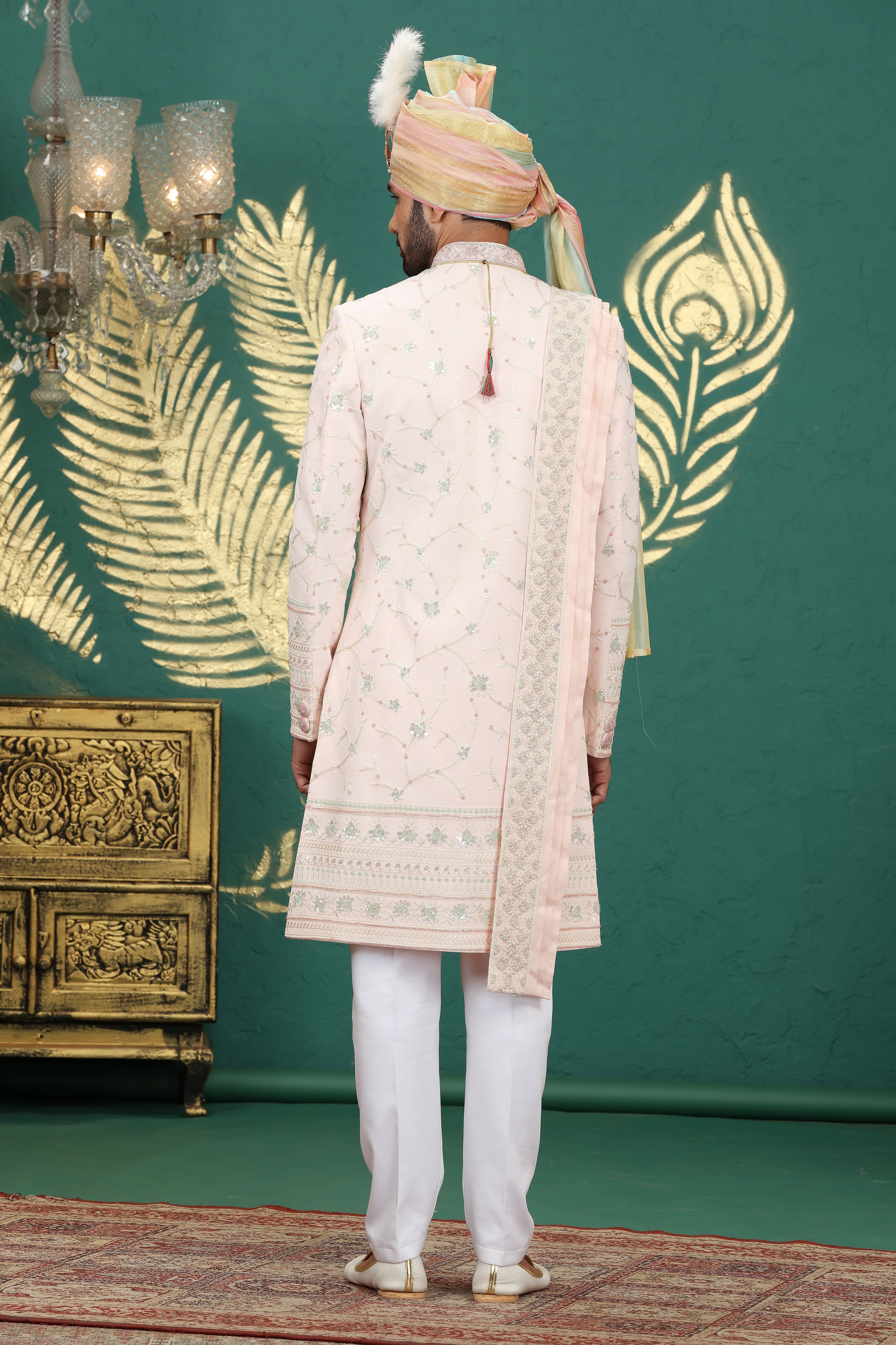 Traditional Indian groom outfit in blush pink silk