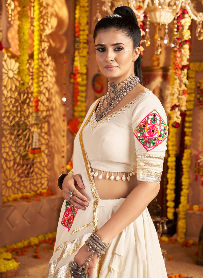 Gujarati white chaniya choli with heavy embroidery and mirror work