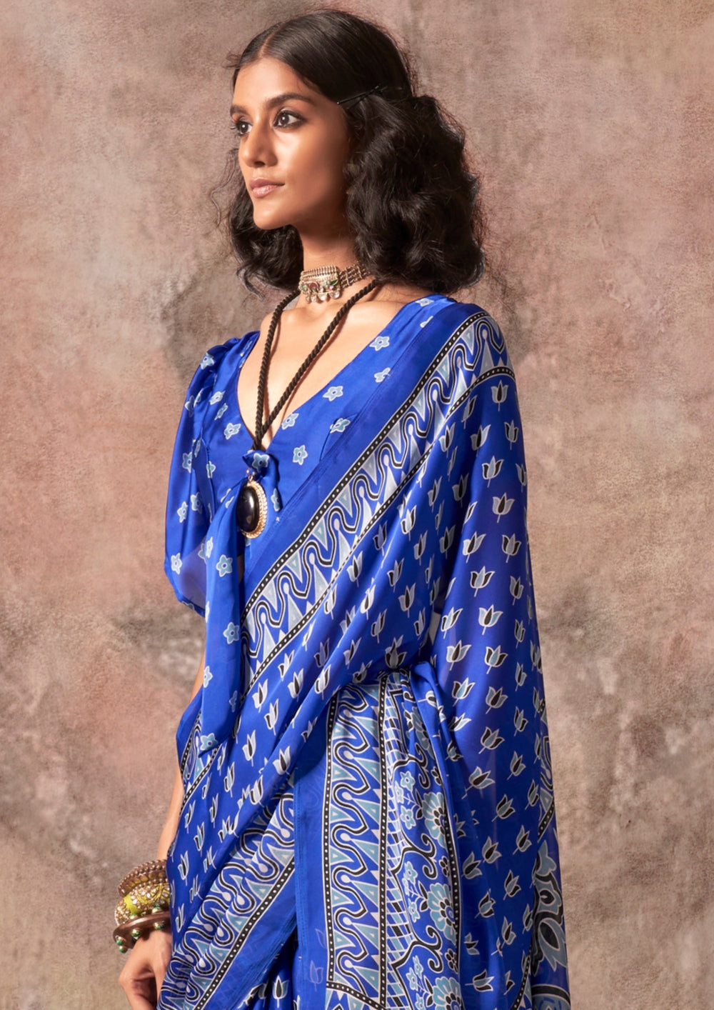 Blue Raisins Ajrakh Printed Satin Georgette Silk Saree 