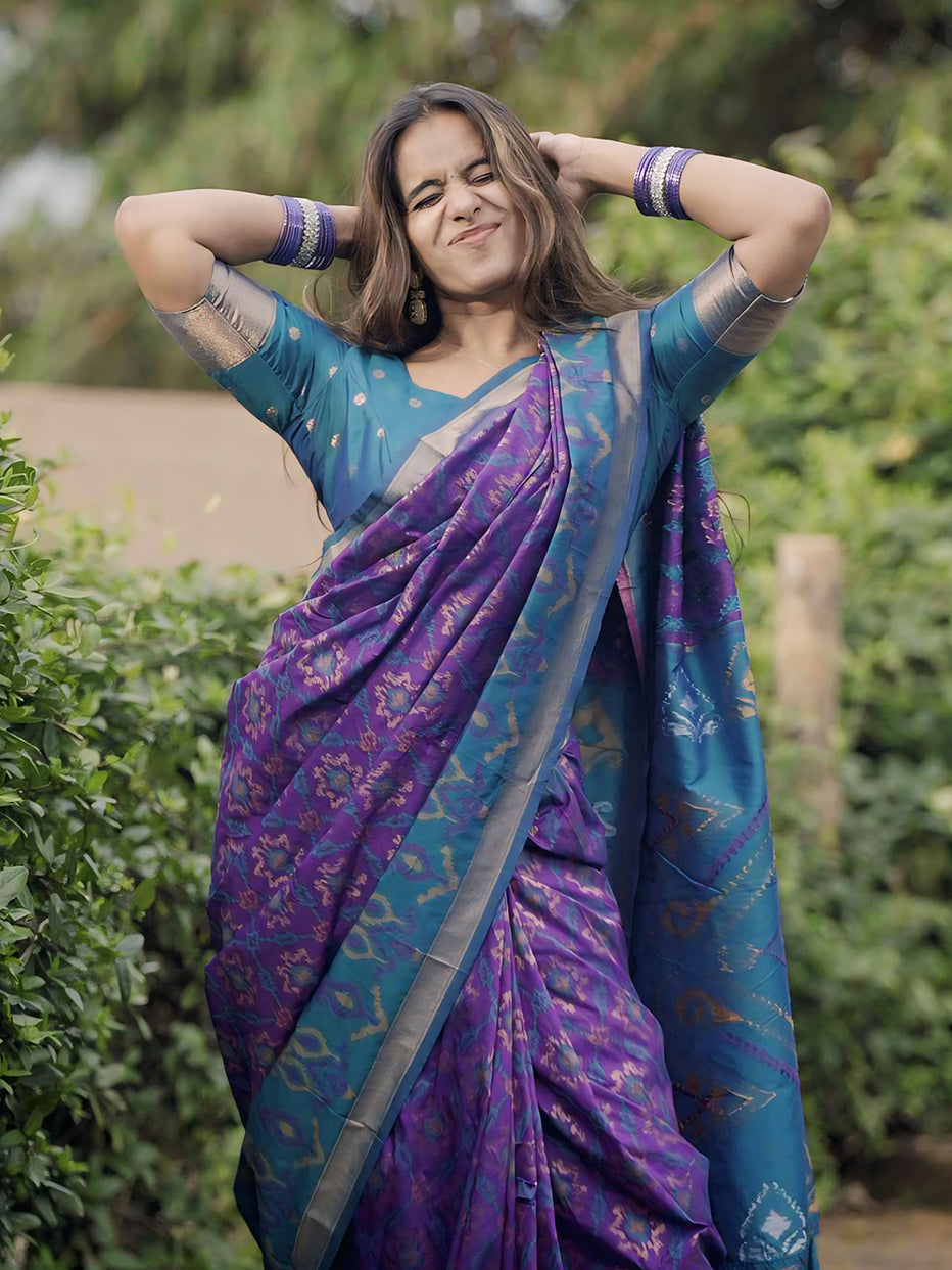 Rupali in our Purple Soft Silk Zari Woven Patola Saree