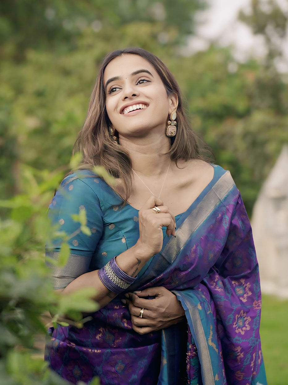 Rupali in our Purple Soft Silk Zari Woven Patola Saree