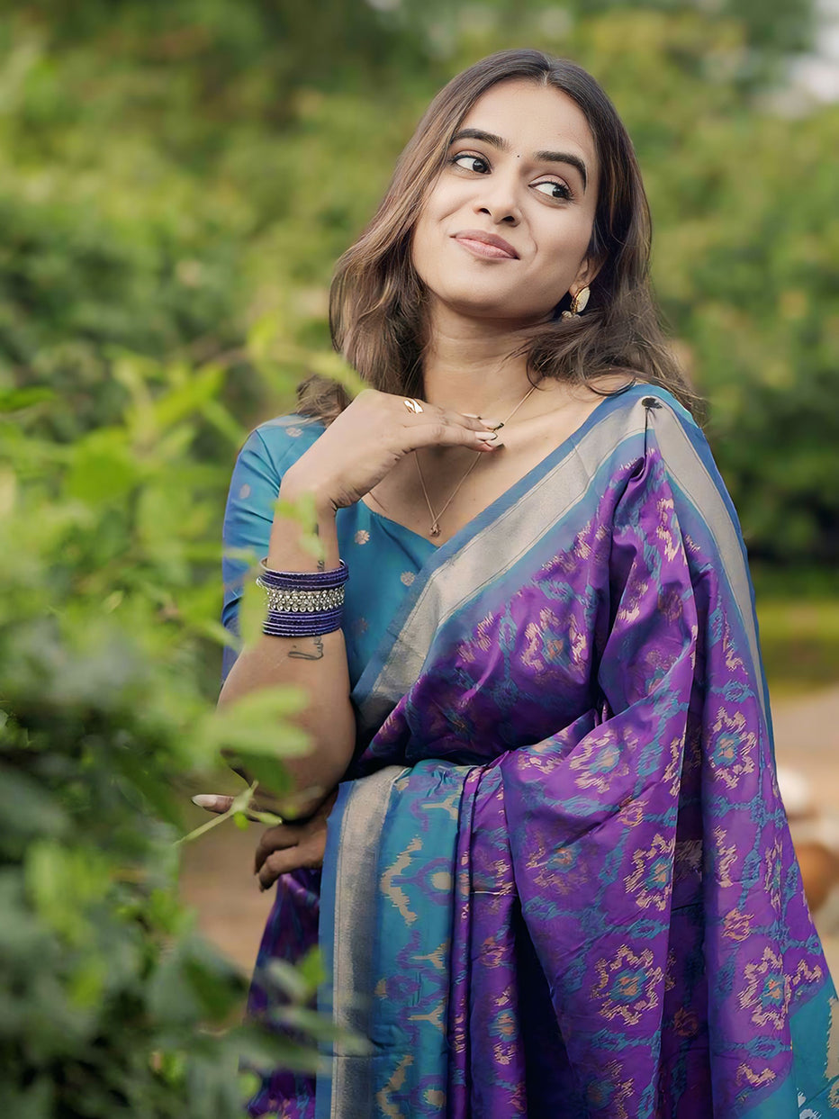 Rupali in our Purple Soft Silk Zari Woven Patola Saree