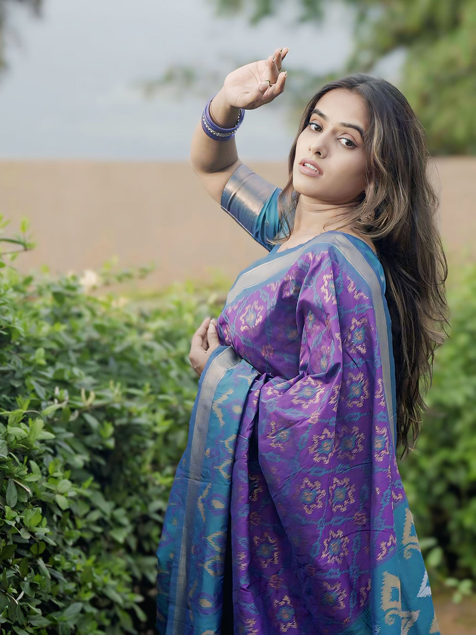 Rupali in our Purple Soft Silk Zari Woven Patola Saree