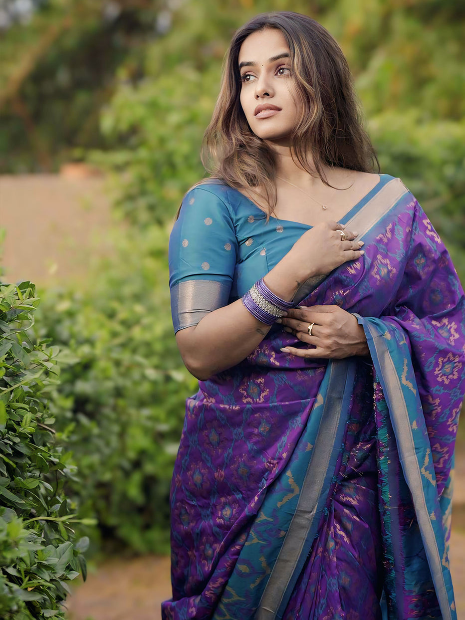 Rupali in our Purple Soft Silk Zari Woven Patola Saree