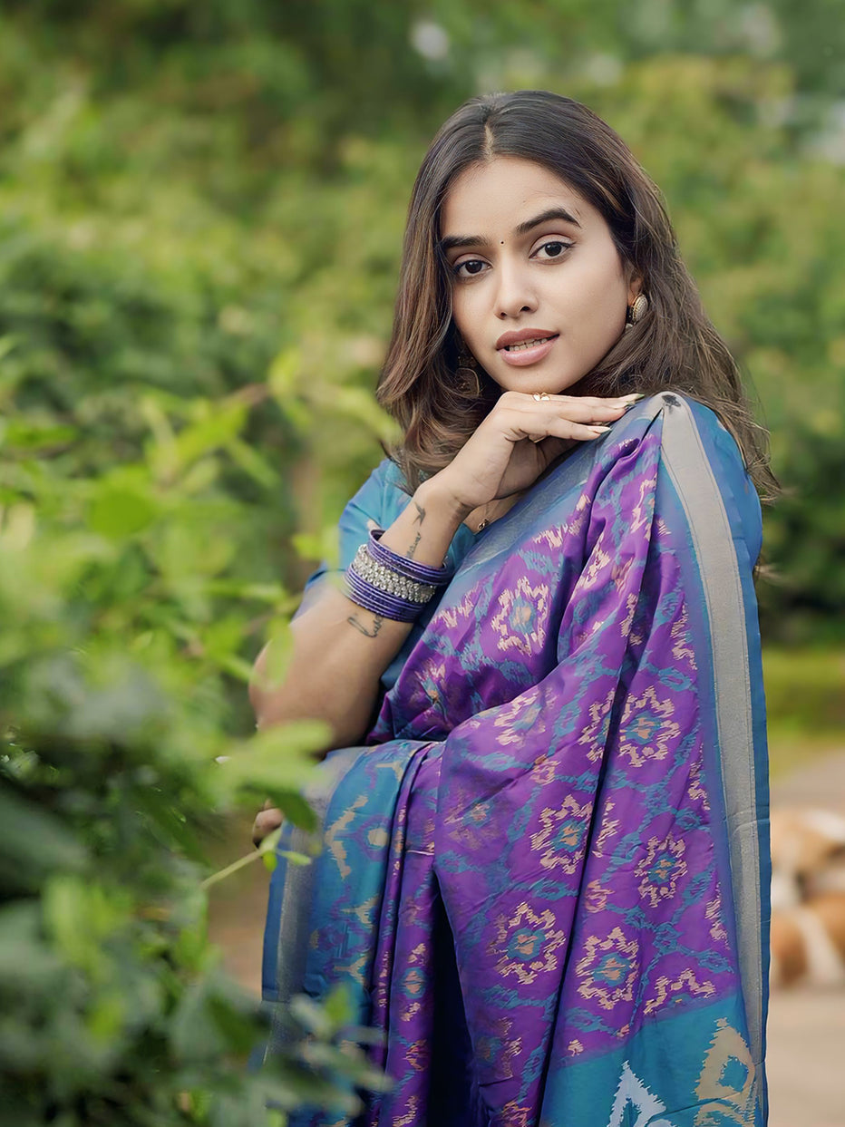 Rupali in our Purple Soft Silk Zari Woven Patola Saree