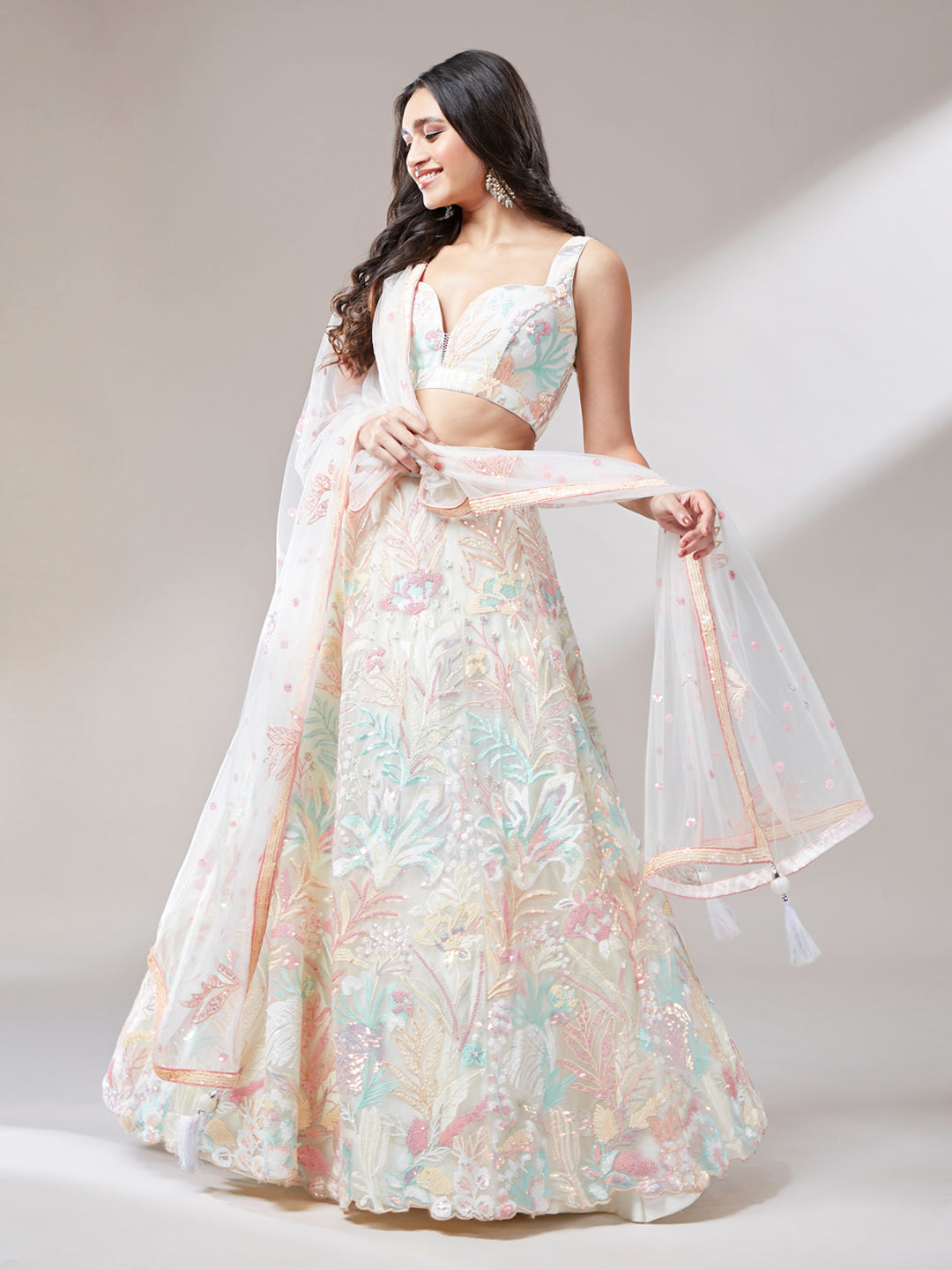 Cream net embroidered lehenga front view

