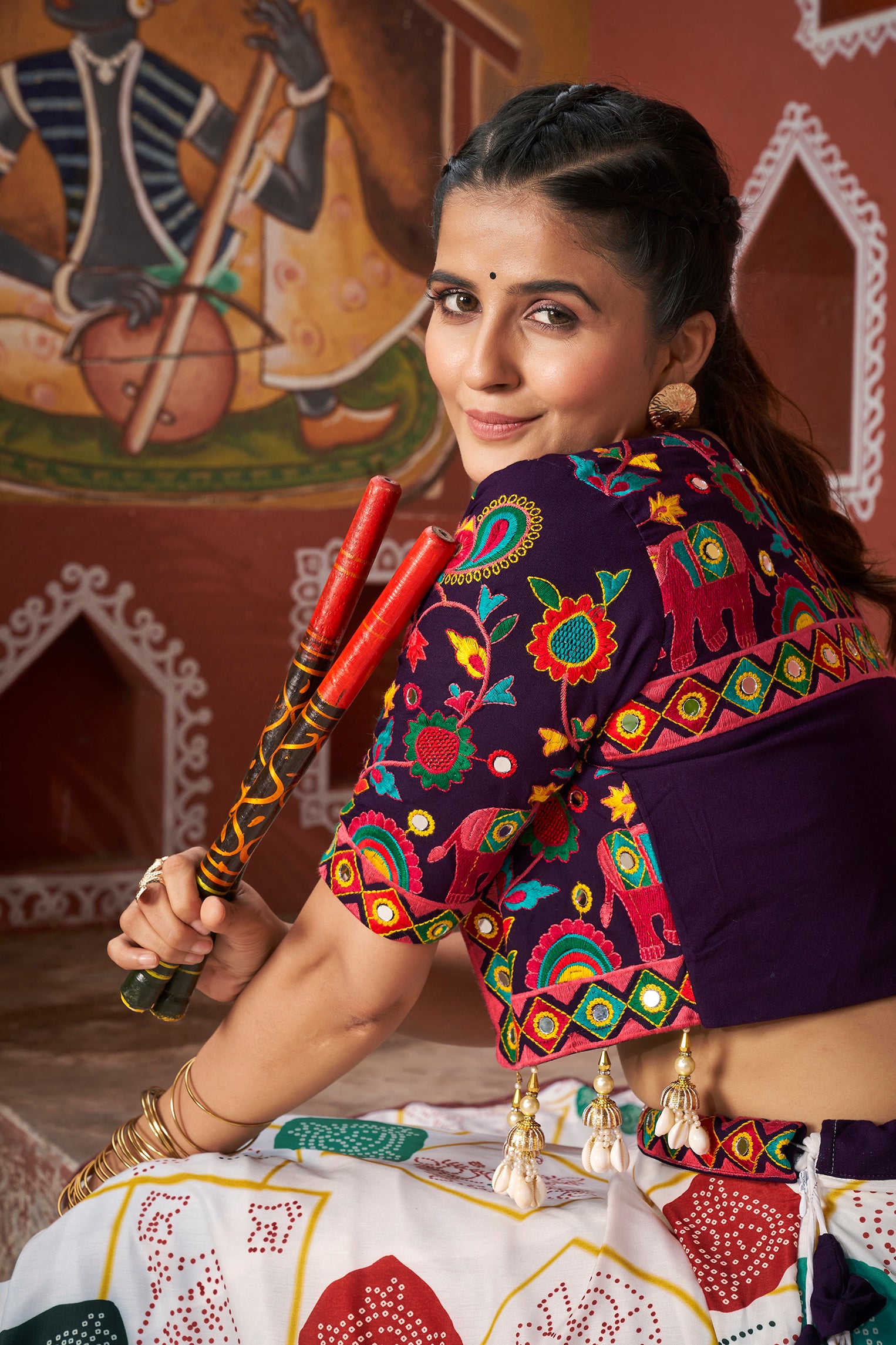 Close-up of printed lehenga and mirror work jacket – Chaniya Choli


