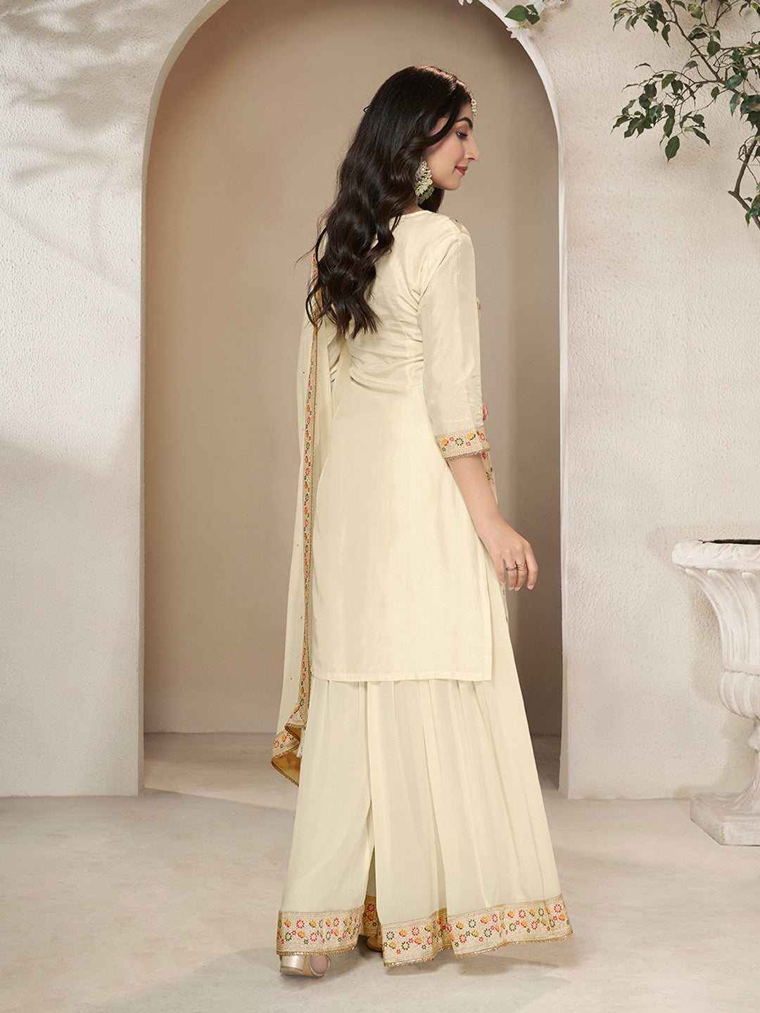 Cream Dola silk suit with embroidered Meena weave and tassel dupatta