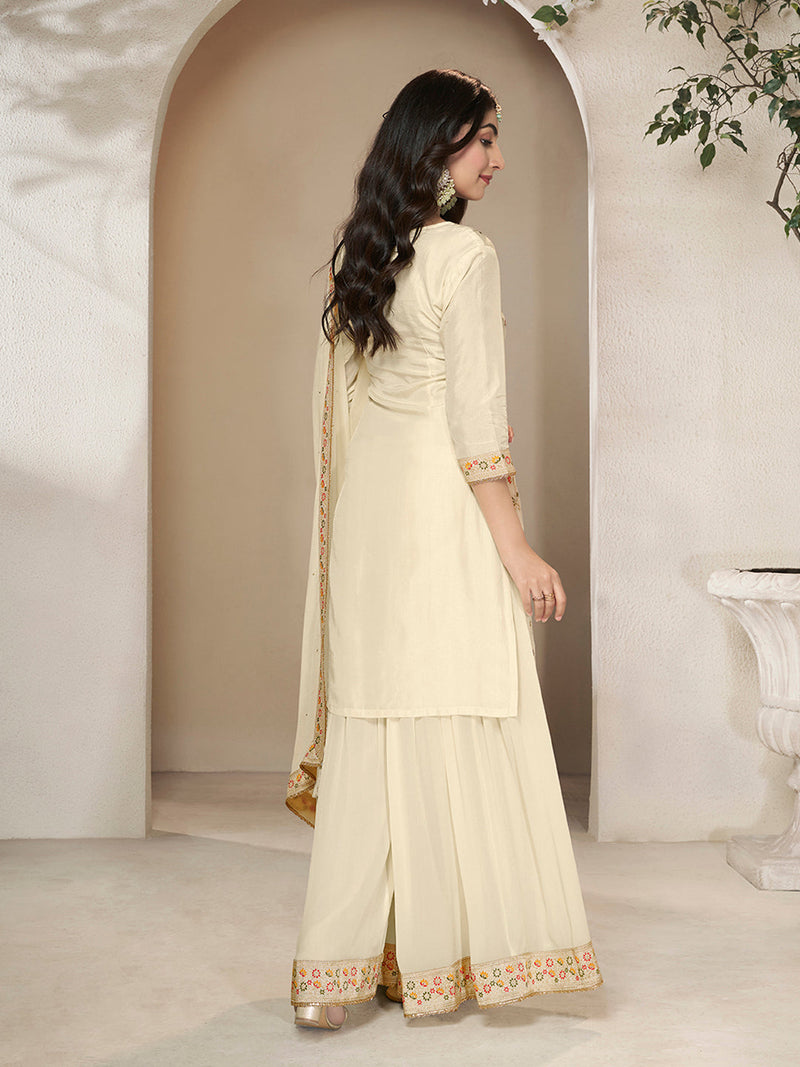 Cream Dola silk suit with embroidered Meena weave and tassel dupatta