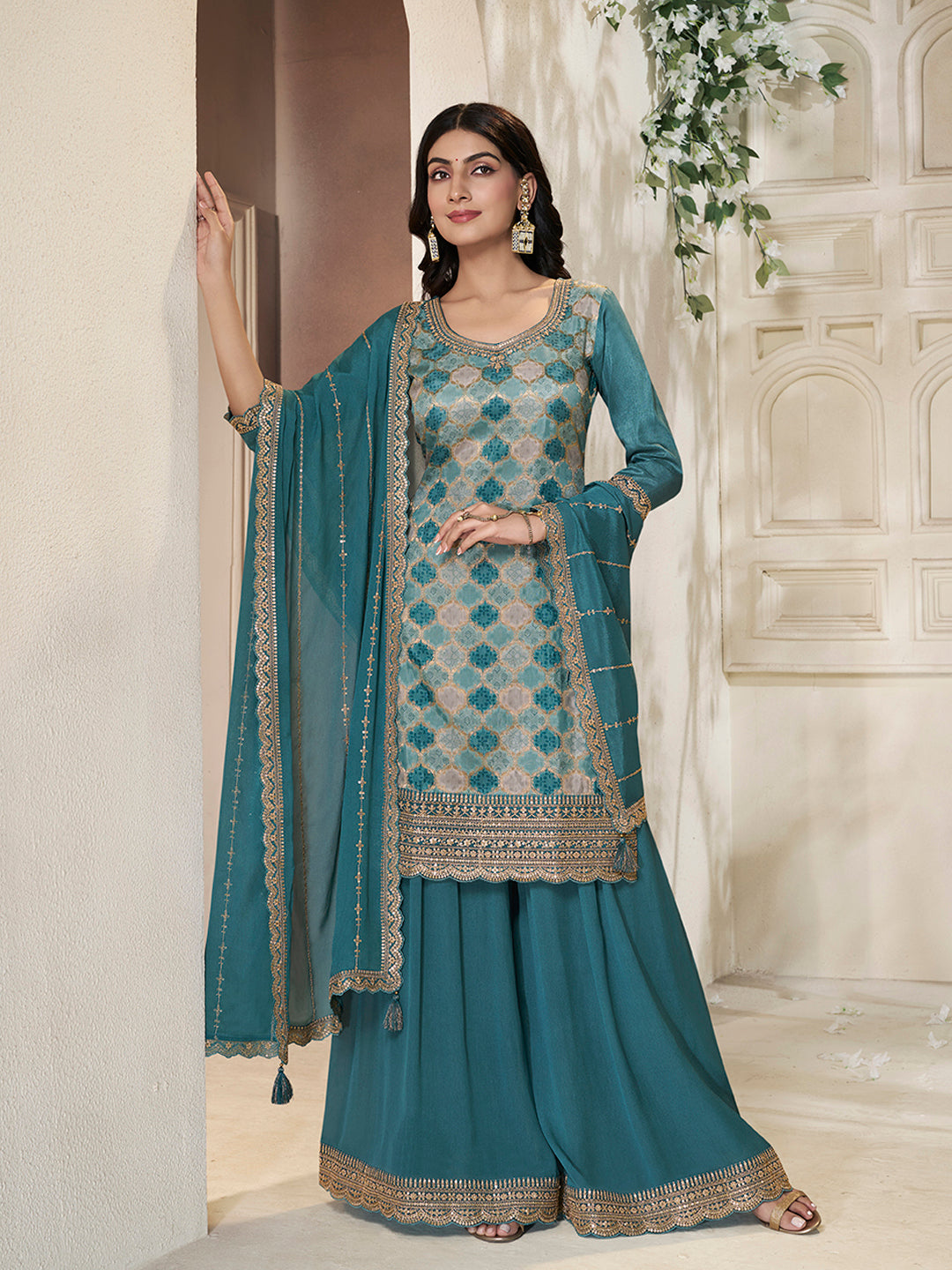 Teal green embroidered sharara suit with sequin detailed kurta