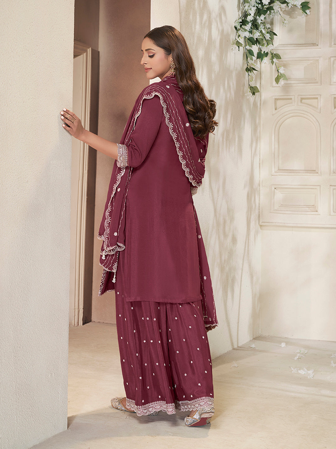 Maroon festive sharara outfit with scalloped dupatta and tassels