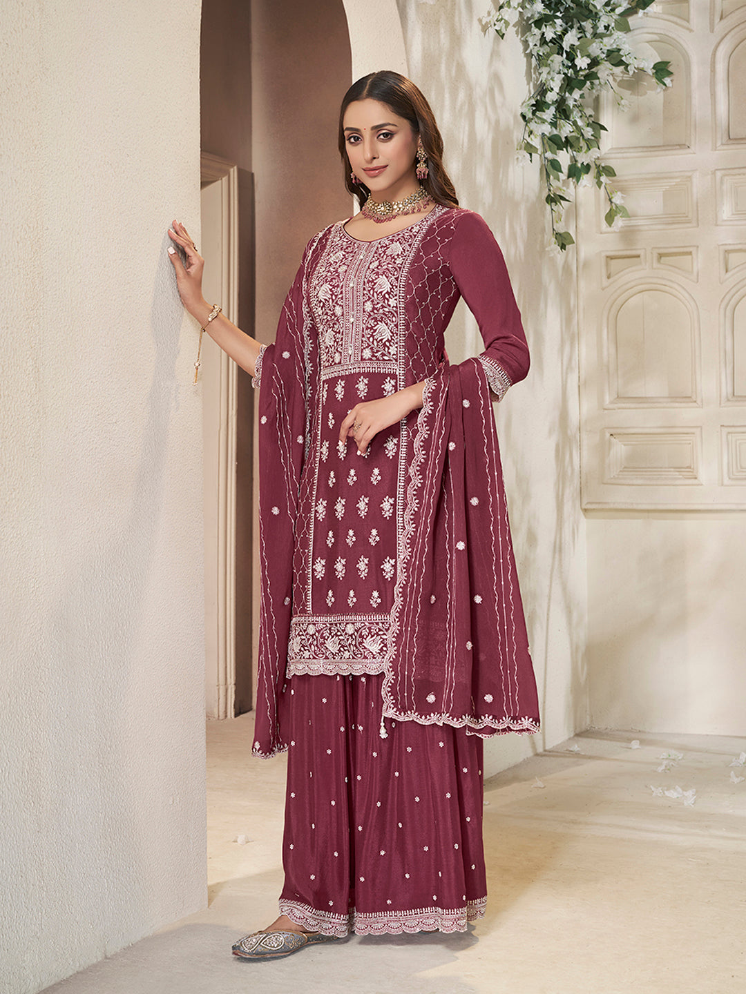 Partywear Indian suit in maroon with white thread work