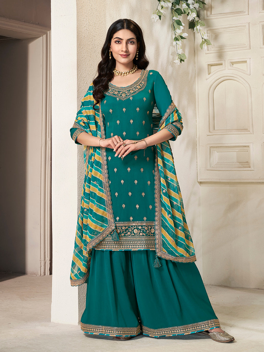 Teal green sharara dress with embroidered kurta and flared pants