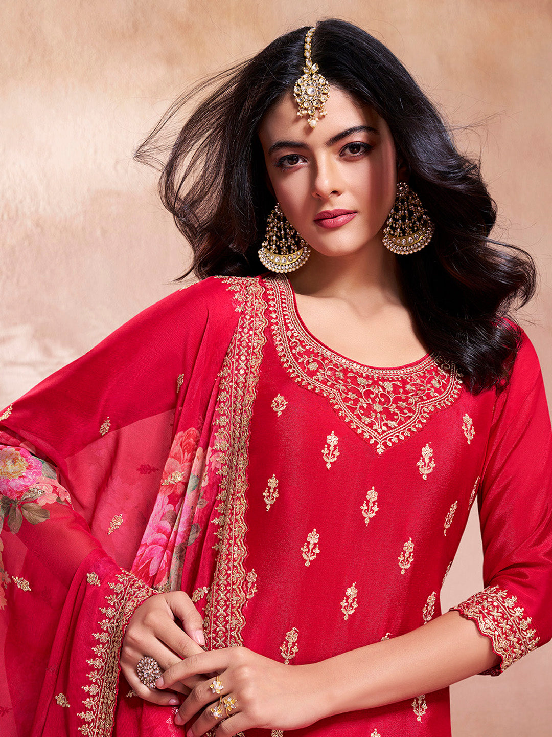 Red traditional Indian sharara suit with heavy embroidery