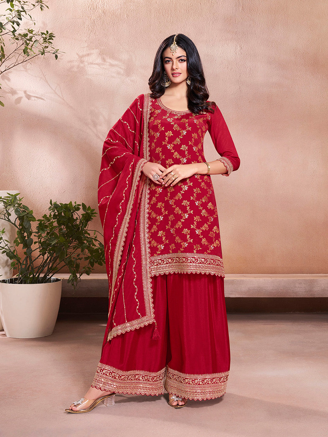Red embroidered sharara suit with floral jaal and scalloped dupatta