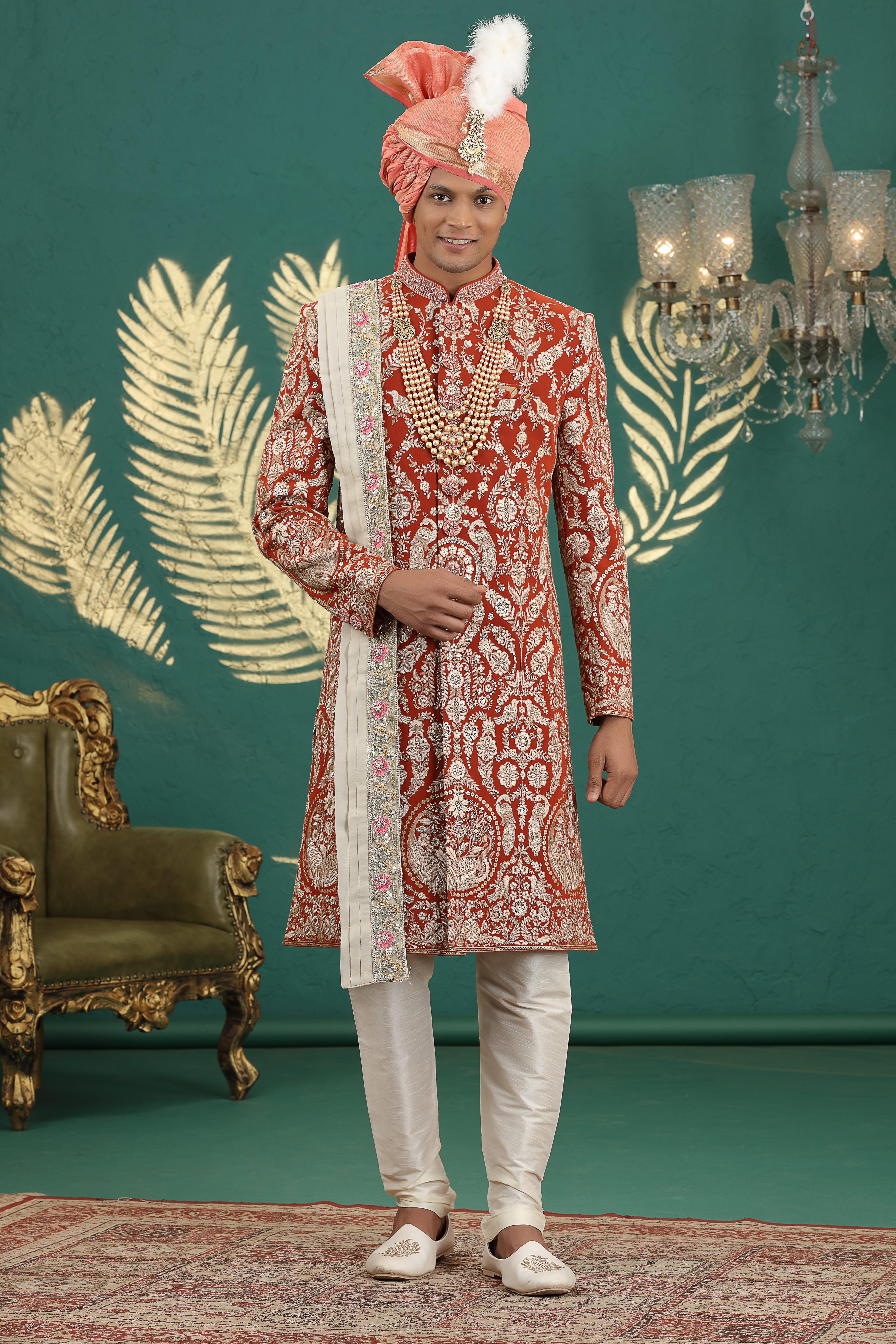 Royal red sherwani for groom with heavy embroidery