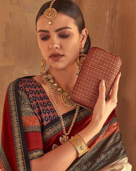Cream Patola Silk Traditional Woven Saree 