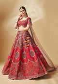 Red embroidered lehenga choli with mirror work and net dupatta – perfect for bridal and festive wear