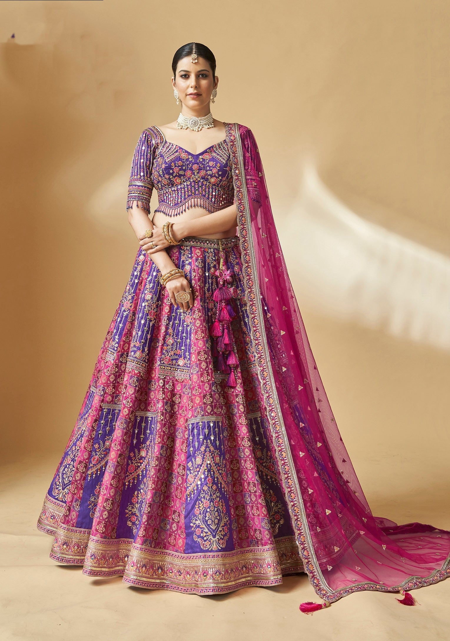 Pink and purple embroidered lehenga choli with mirror and zari work