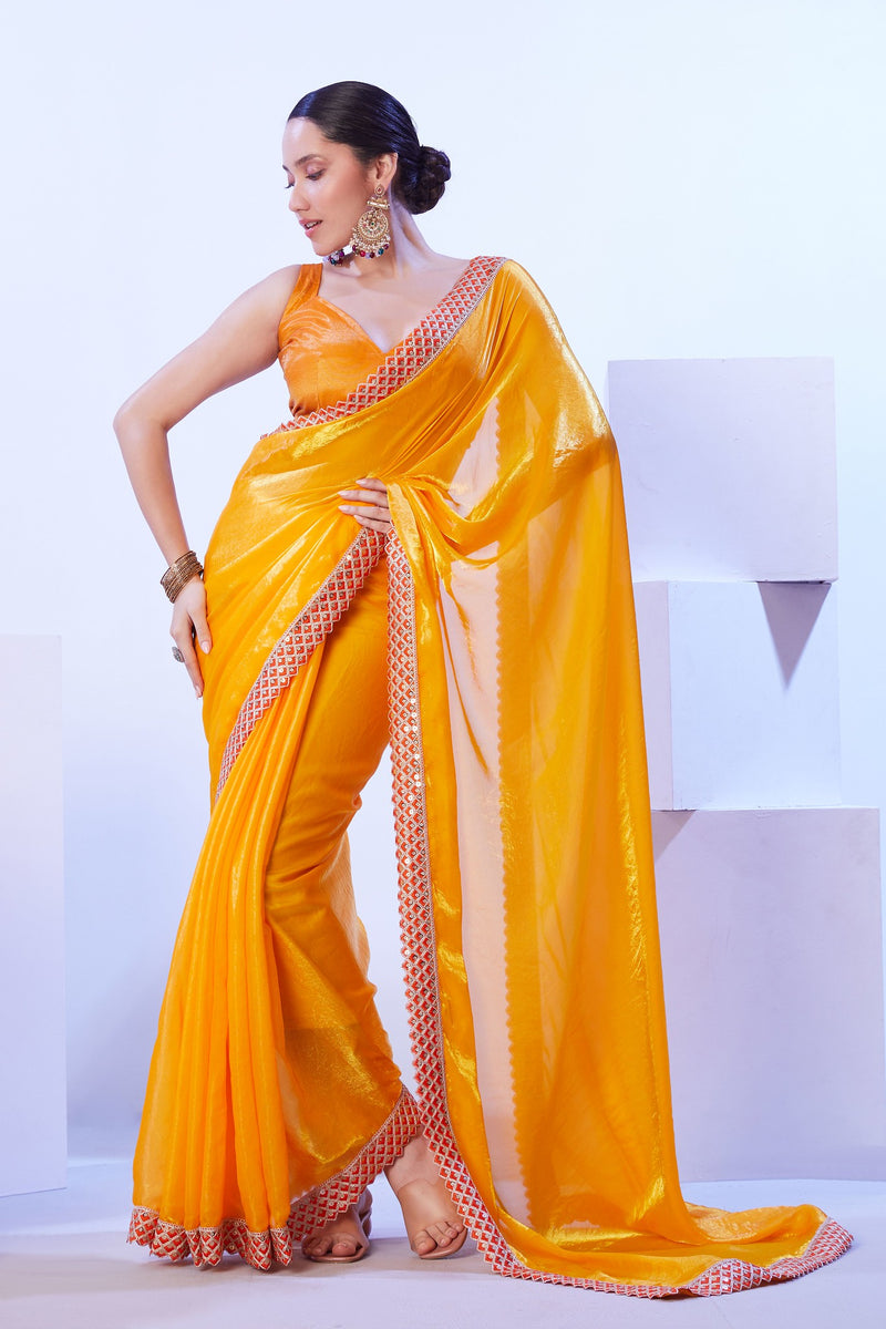 Sequin embroidered border on mustard saree