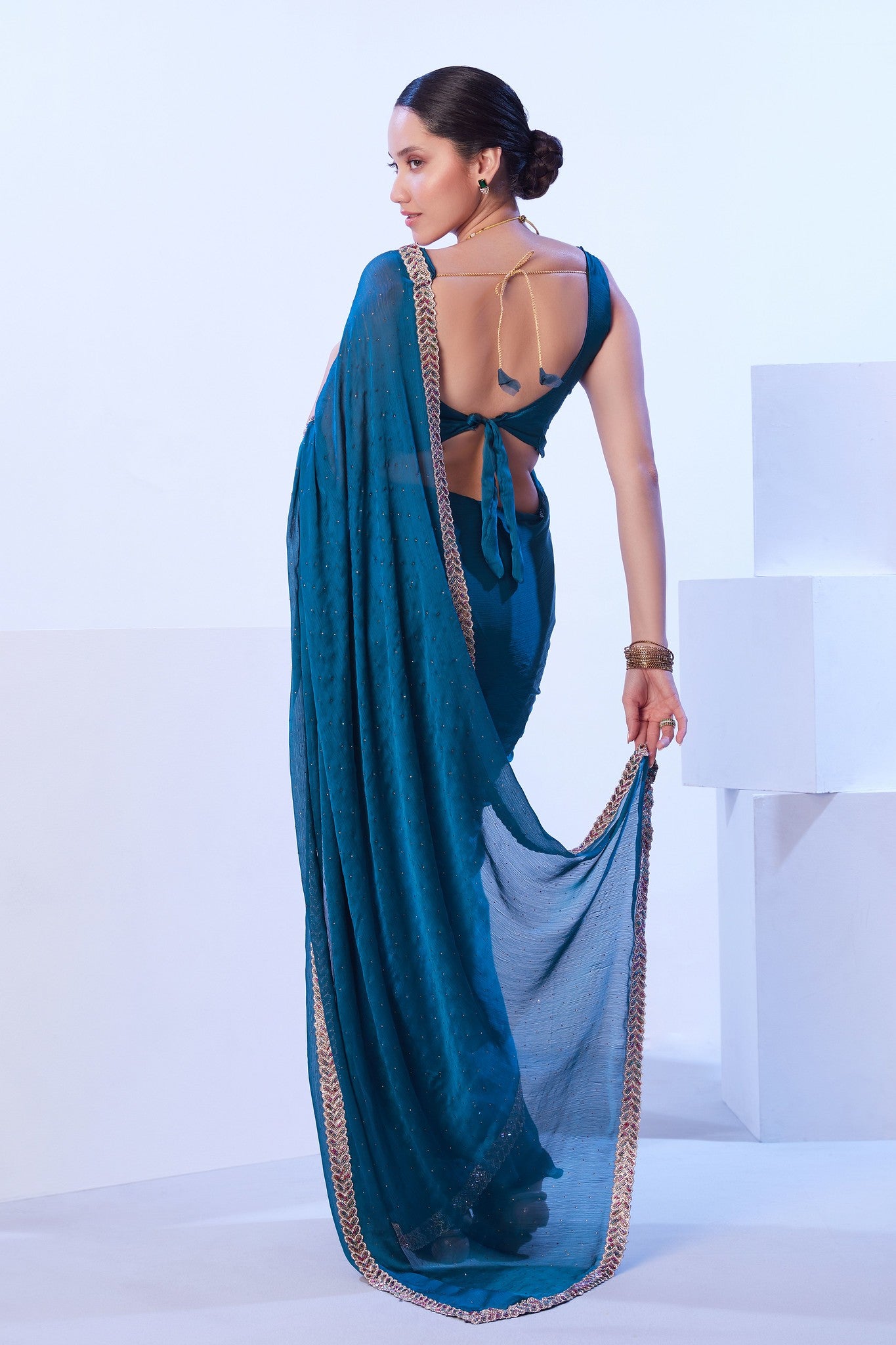 Glossy jimmy choo saree in teal color