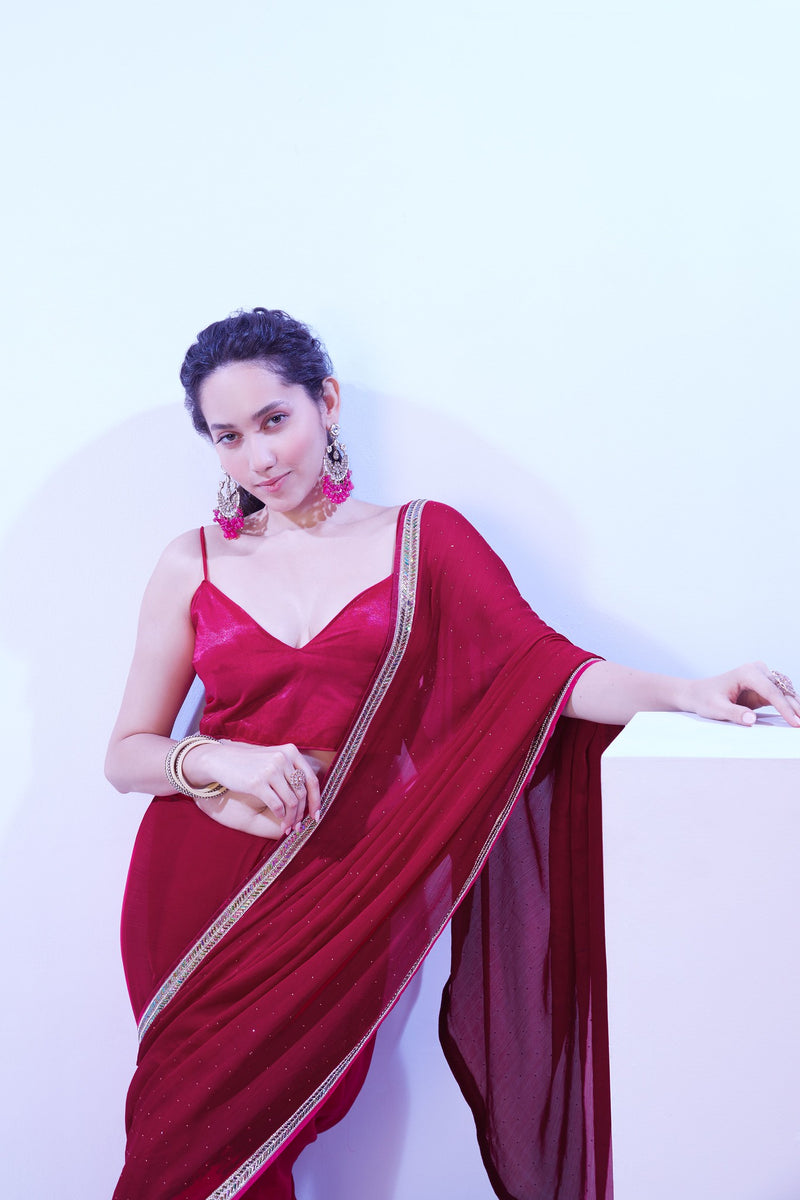 Glossy maroon saree with golden lace