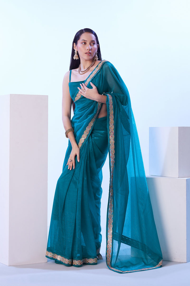 Teal green jimmy choo saree with golden lace