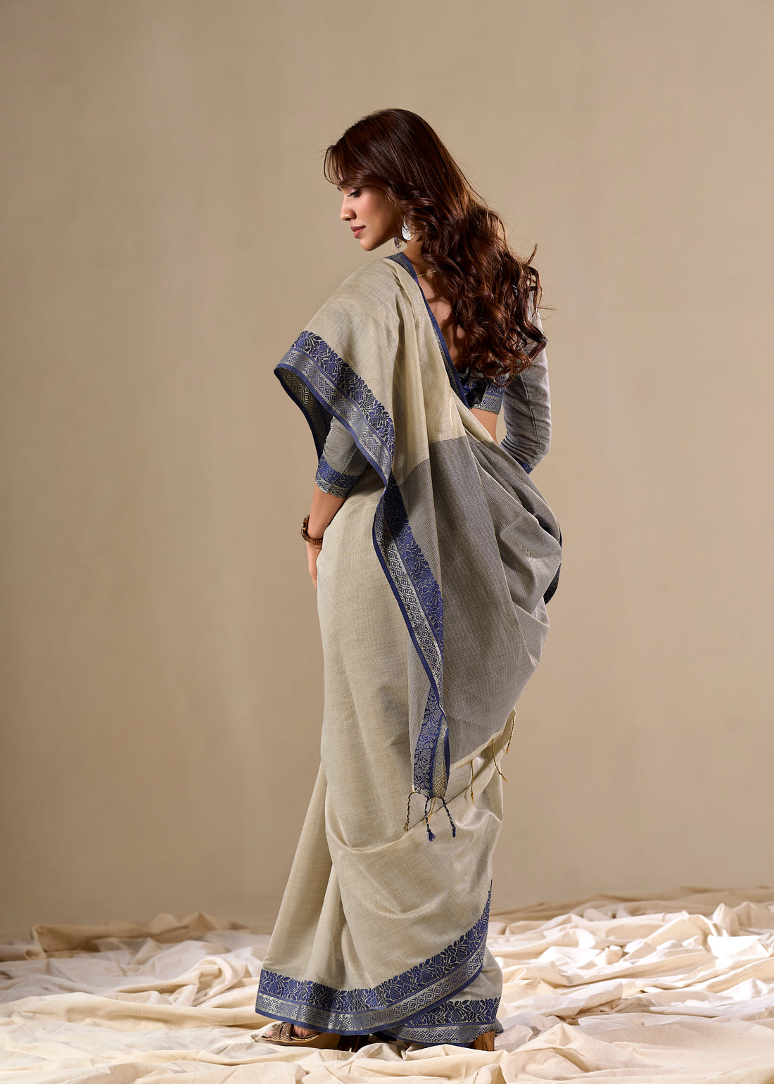 Cream handloom saree with blue border

