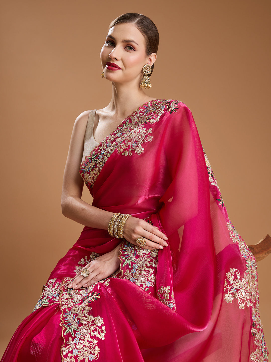 Party wear saree in magenta color with floral embroidery