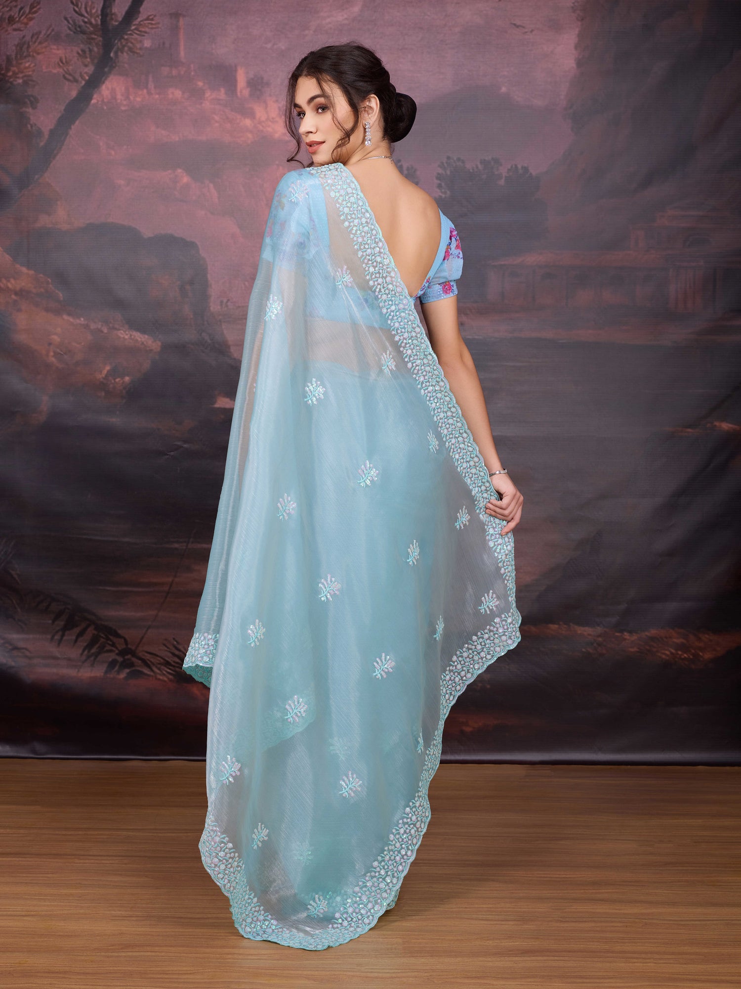 Sky blue shimmer saree with intricate sequin work

