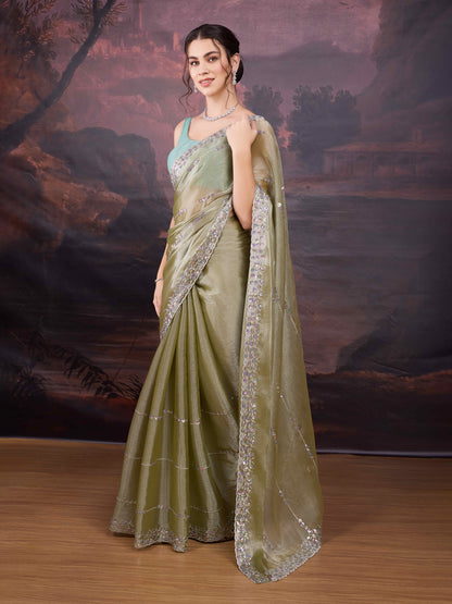 Lightweight green embroidered saree with shimmer