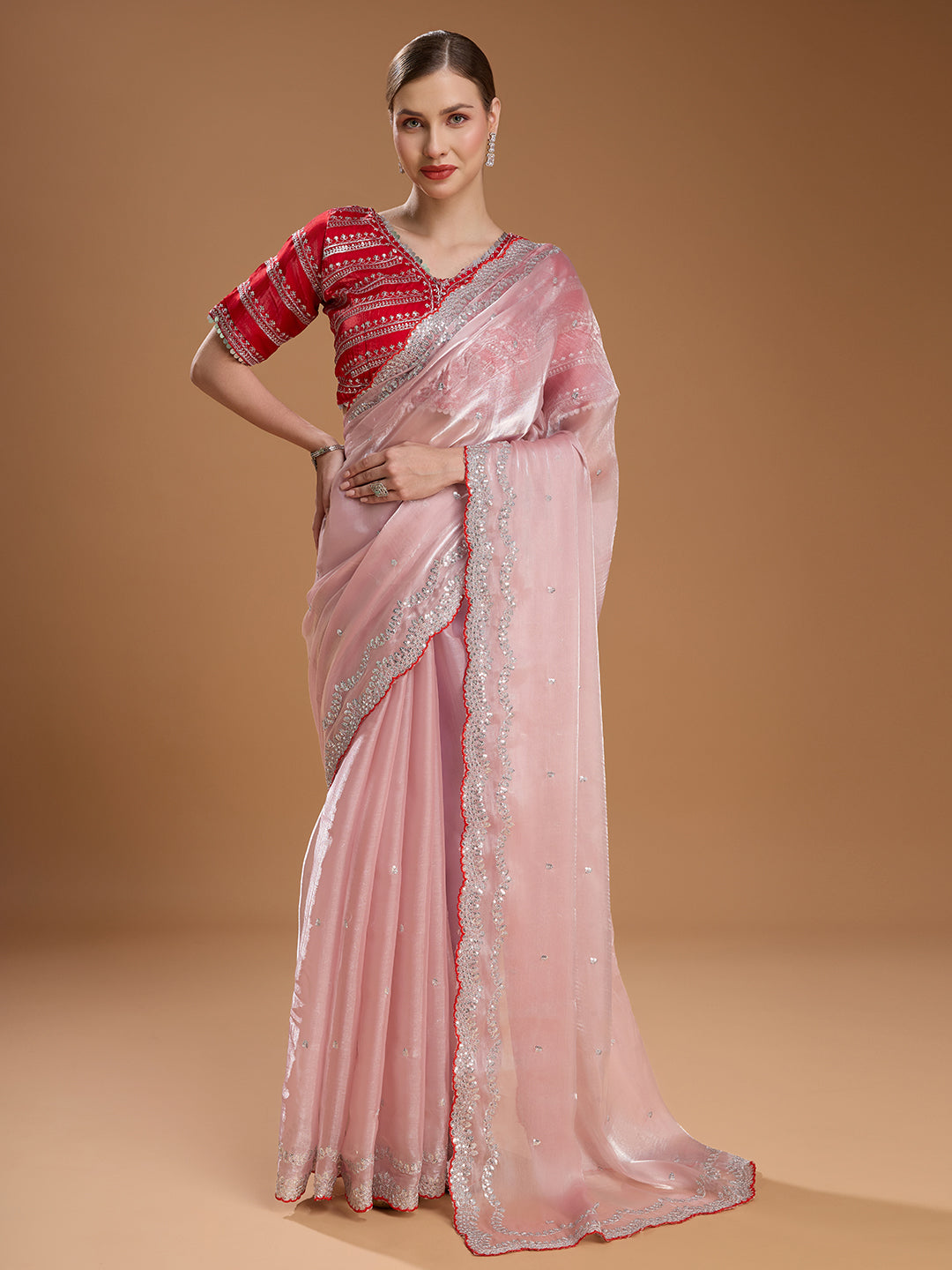 Baby pink Jimmy Choo saree with red blouse